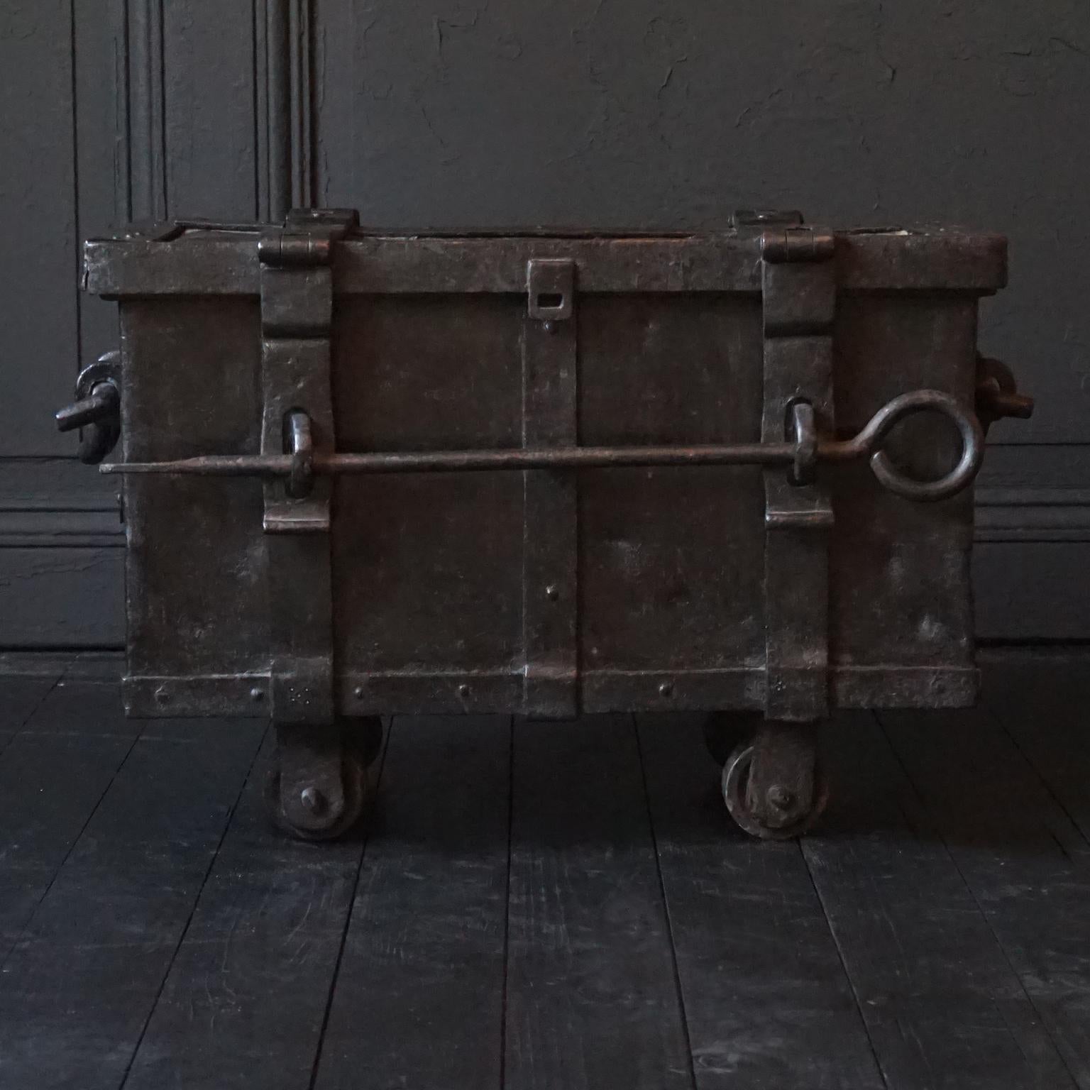 A rare amazing heavy (25+ kilos) handmade German Neurenberg war ammunition or treasure chest on wheels from the first half of the 19th century. 
Rectangular strongbox of sheet iron with cast and wrought iron reinforced edges and hinges. 
Without