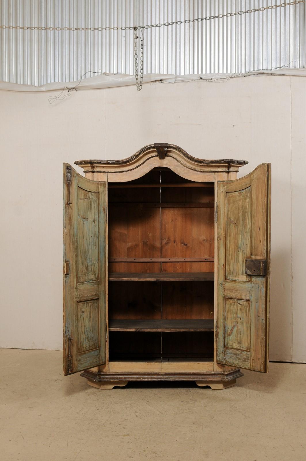 19th C. German Tall Storage Cabinet w/ Arched Cornice & Decorative Carvings In Good Condition For Sale In Atlanta, GA