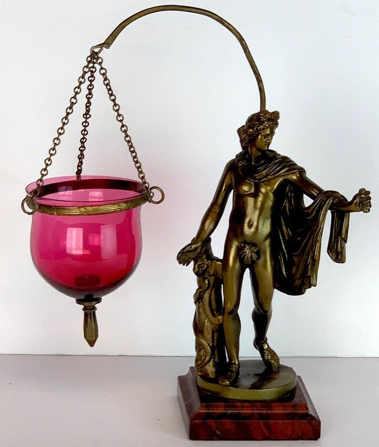 Grand Tour Bronze Apollo Belvedere After Leochares, Votive, or Oil Lamp
Italy, circa late 19th century 


A fine example of classical antiquity is this exquisite Grand Tour bronze sculpture, Votive or Oil Lamp, depicting the Apollo Belvedere after