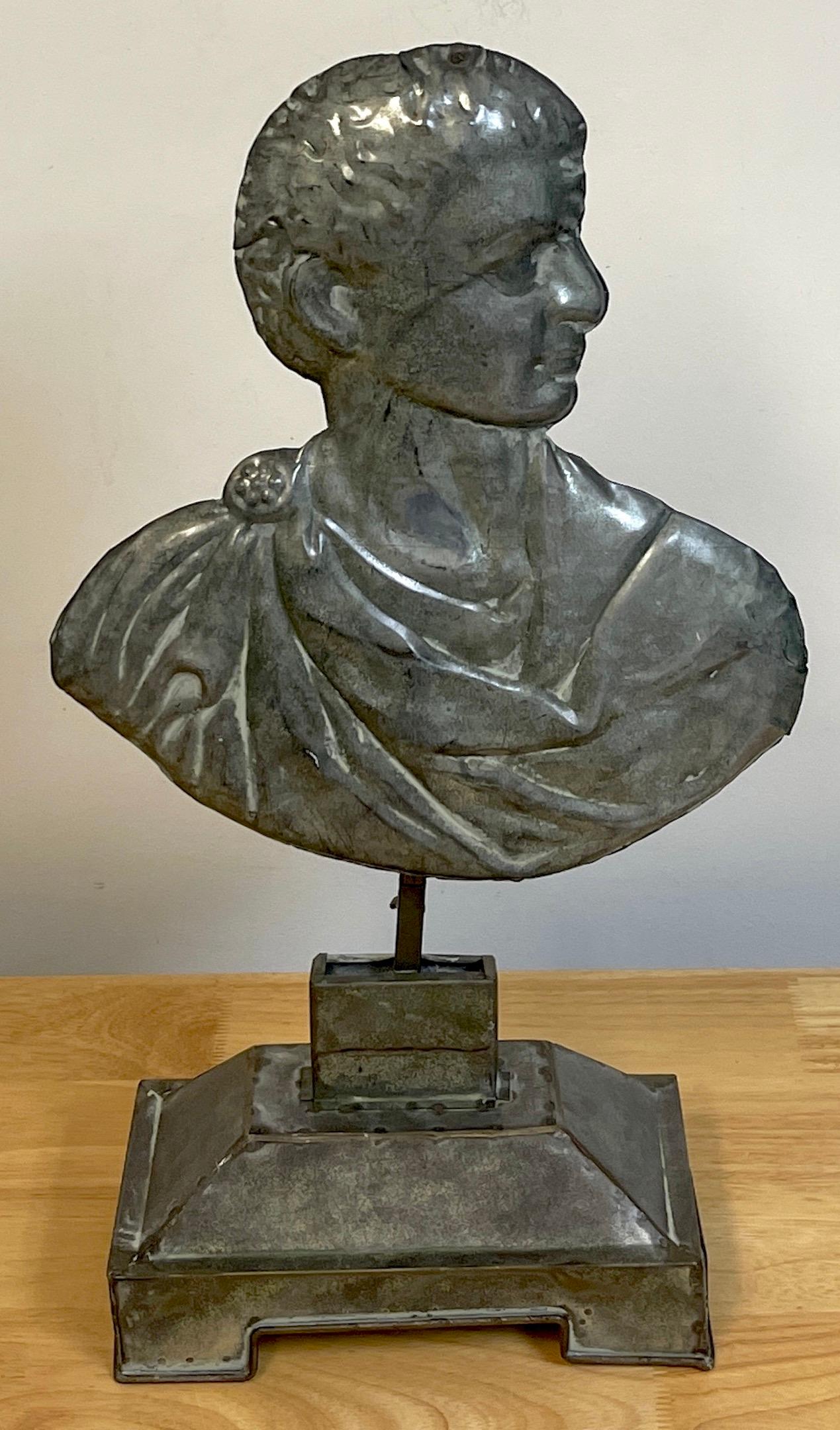 19th C Grand Tour Italian Tole Portrait Bust of a Roman Emperor, Subtle polychromed adjustable portrait bust of a draped Roman, raised on a rectangular footed 8.75 W x 5