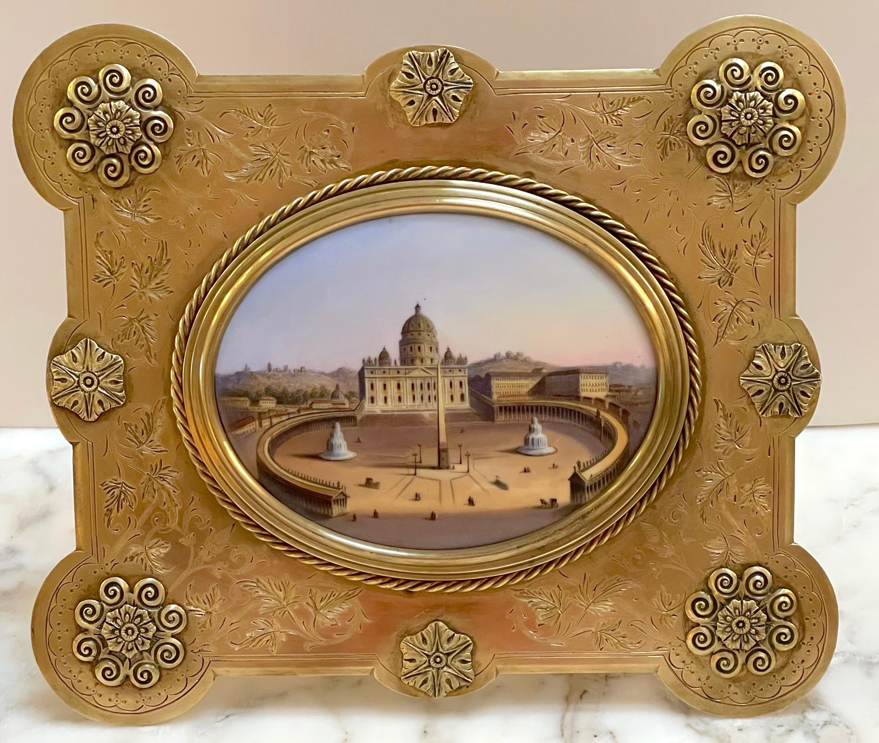19th century Grand Tour Painting on Porcelain View of Vatican/St. Peter's Basilica
Italy, circa 1880s

Standing in rectangular gilt bronze engraved frame with applied stylized flower-heads, holding the 7-inch wide x 5.5 -inch high oval painting