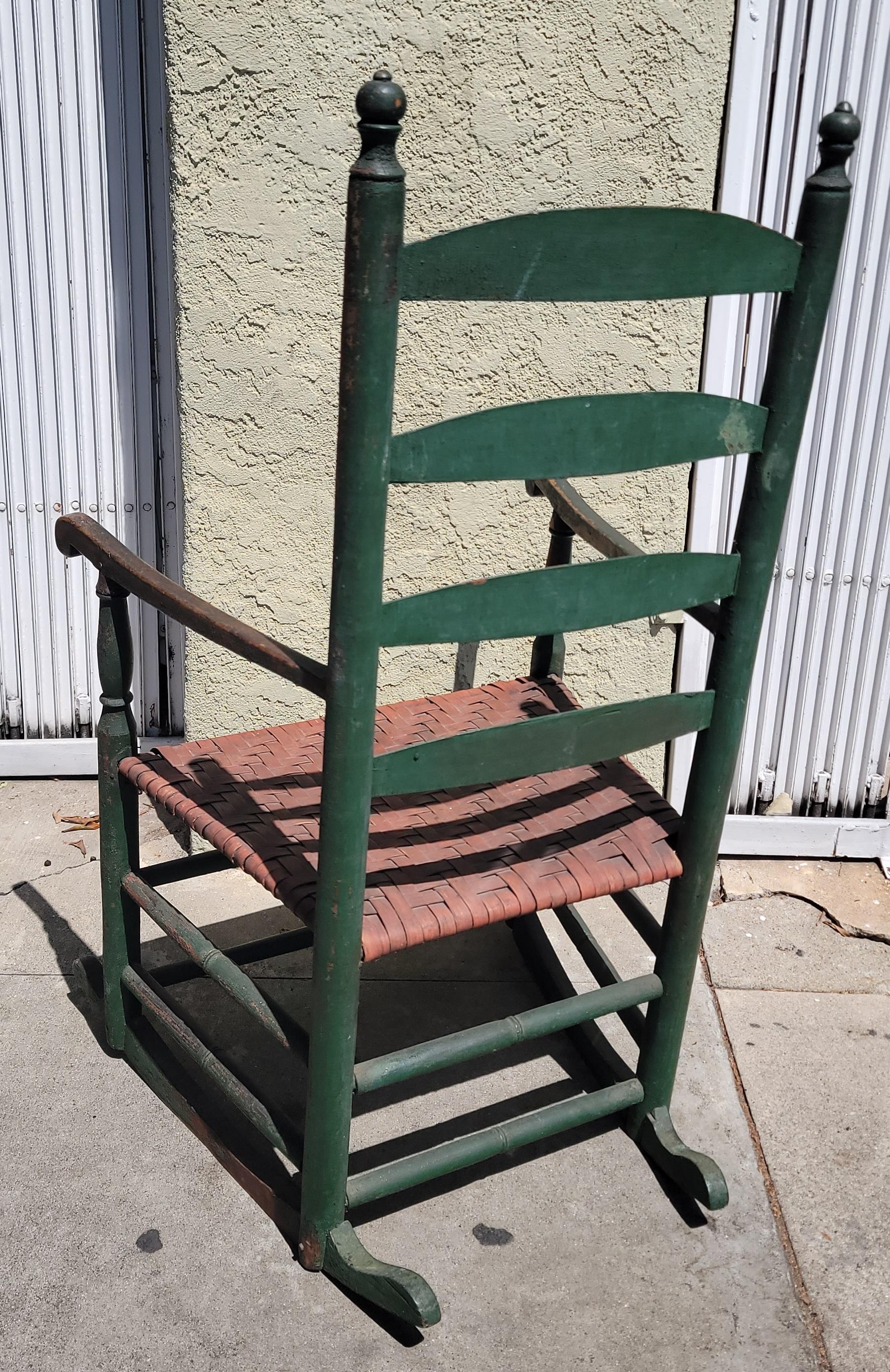 antique rocking chair with woven seat