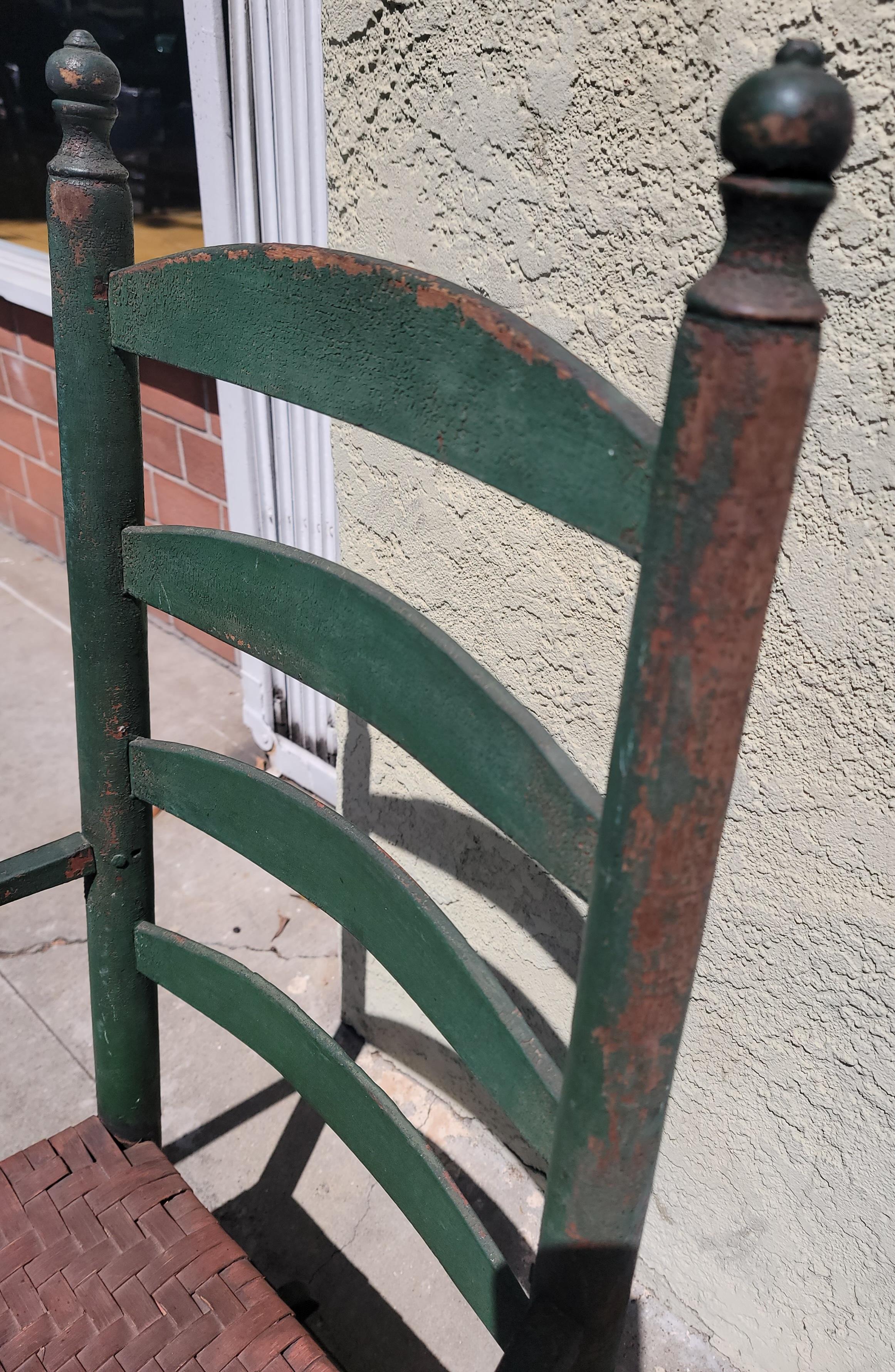 Adirondack 19th C Green Ladder Back Rocking Chair W/ Red Woven Rush Seat For Sale
