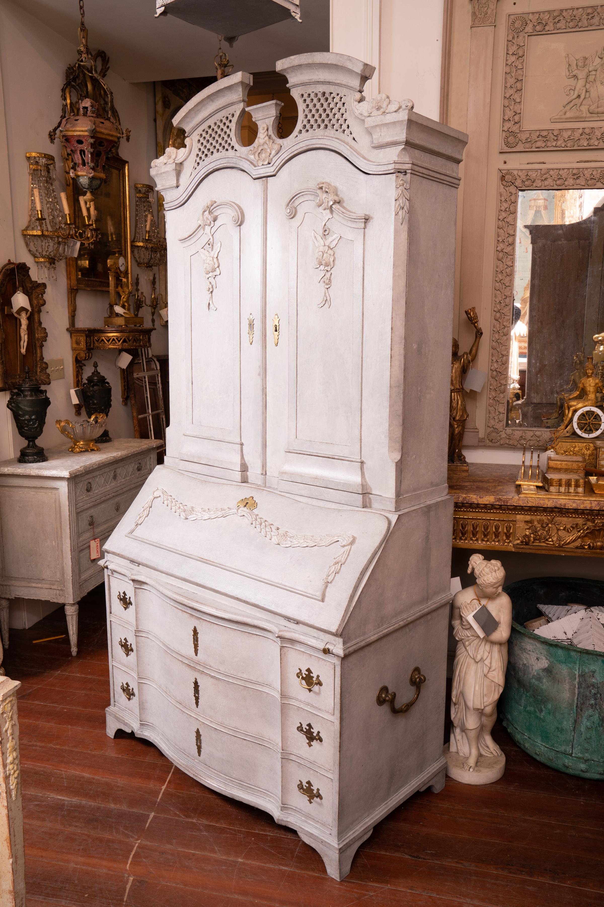 Beautifully carved and painted Gustavian Secretary. The carving is the Swedish take on French neoclassical style with the light muted paint tones to brighten up interiors during the long winters months.