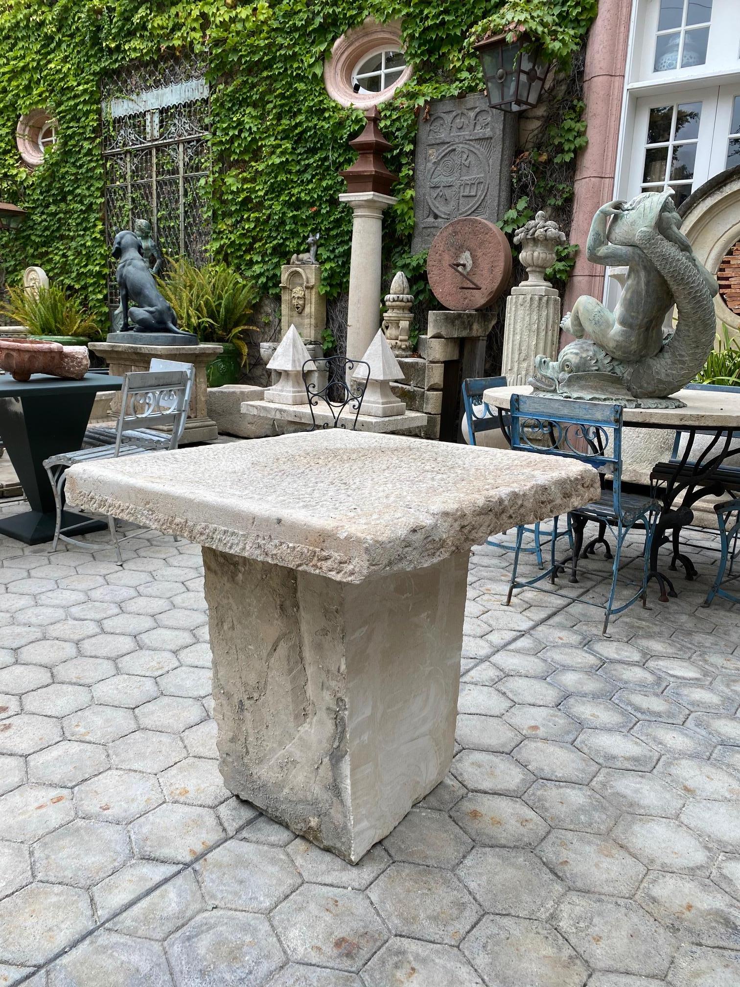 18th-early 19th century elements Hand carved stone antique garden patio coffee outdoor indoor table for two or four. It will be the perfect touch by an outdoor fireplace or on the patio next to your bedroom to have the morning coffee and welcome a