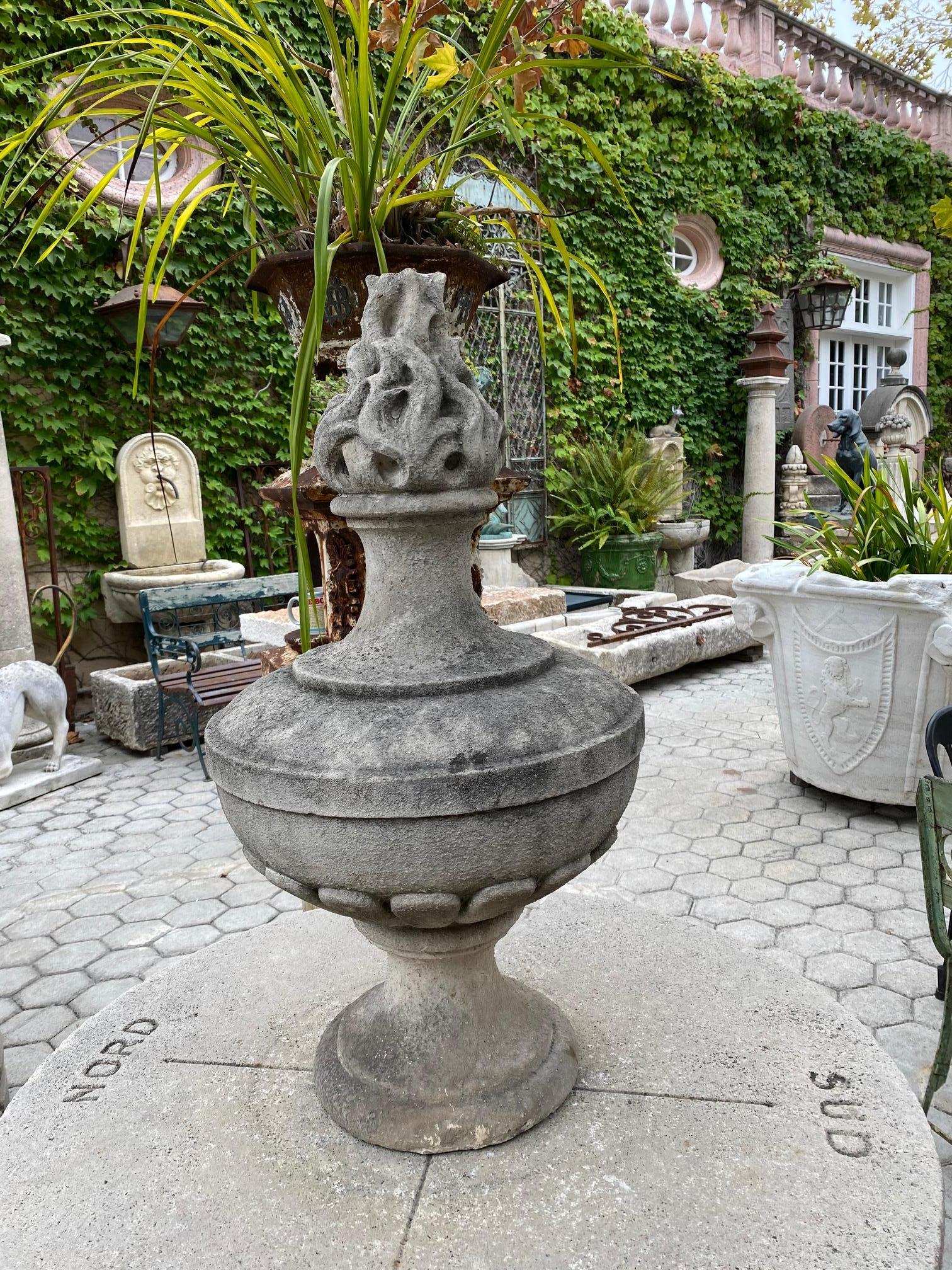 Large center piece late 18th-early 19th century hand carved stone flambeau finial to mount on garden post by a gate or simply using it as beautiful decorative element in an interior on a console or a garden table. The nicely rounded carved Body on