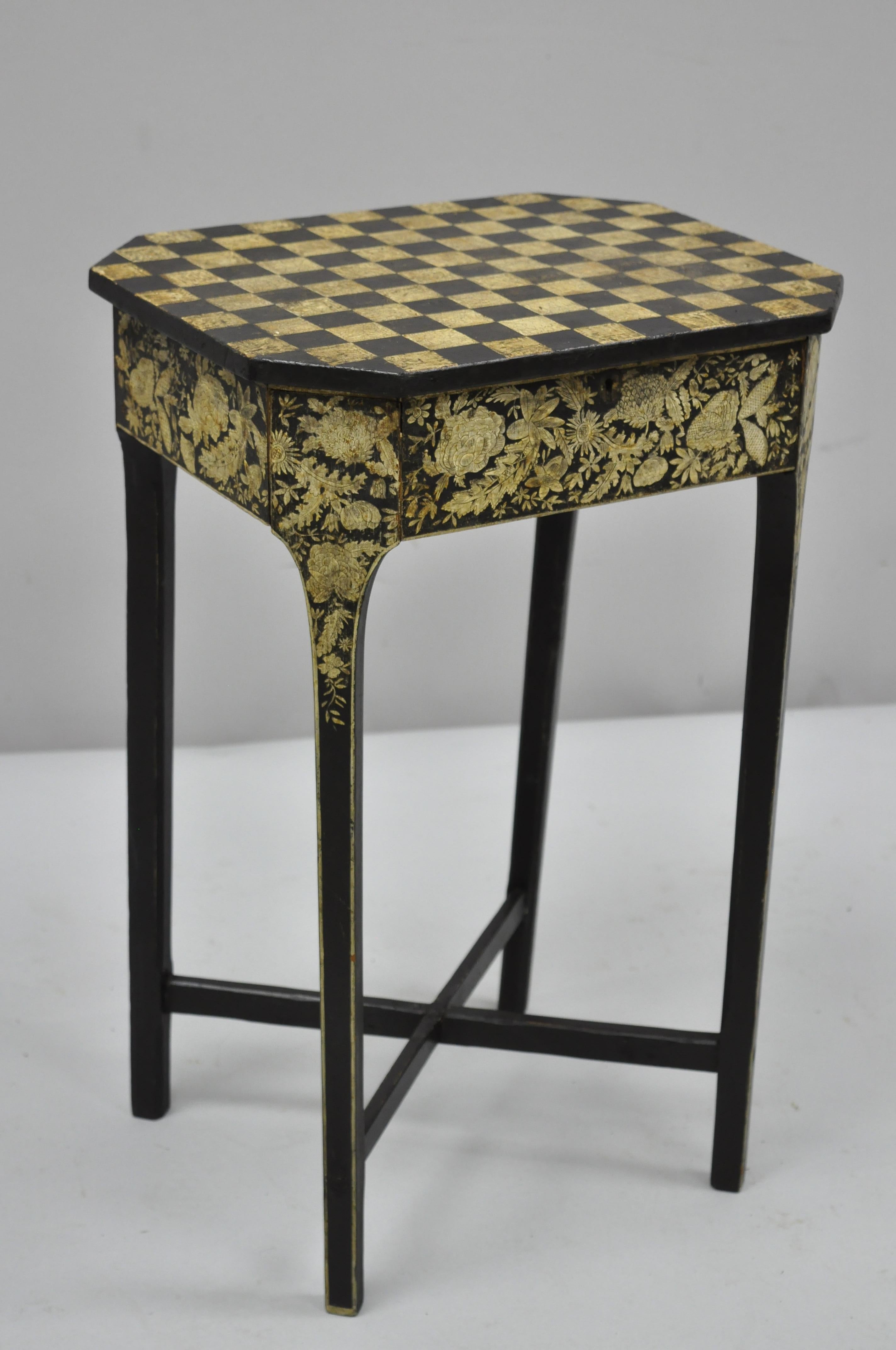 19th century hand painted black and cream checkerboard Victorian accent side table. Item features faux drawer with keyhole, remarkable original paint decoration, checkerboard top, floral paint decoration on all sides, solid wood construction,