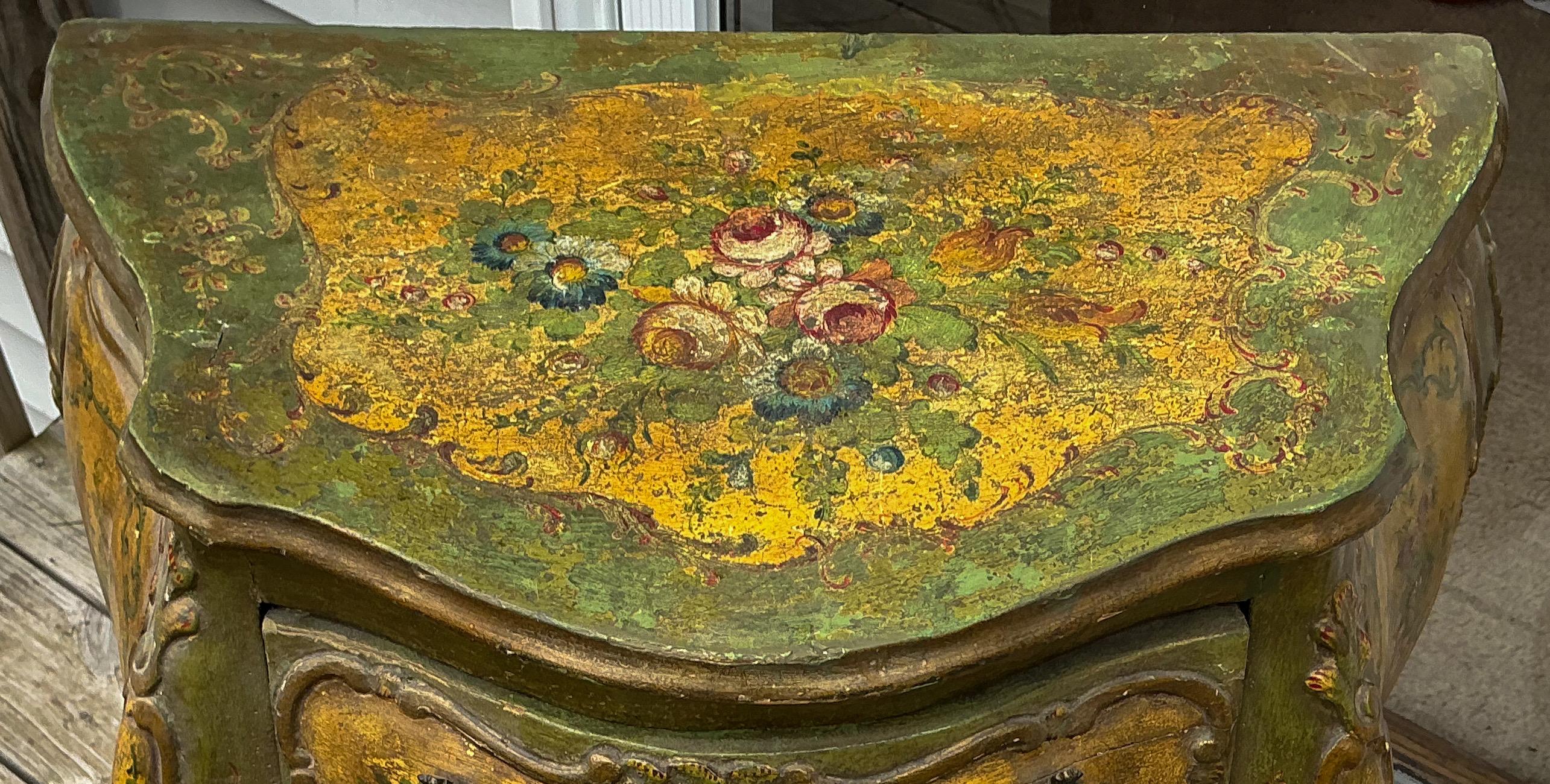 Love original paint! This is a turn-of-the-century hand painted Venetian bombe chest or commode. The drawers are paper lined, and the small bronze pulls are original. At its widest point, the length is 27.5”. The flowers are beautifully done and are