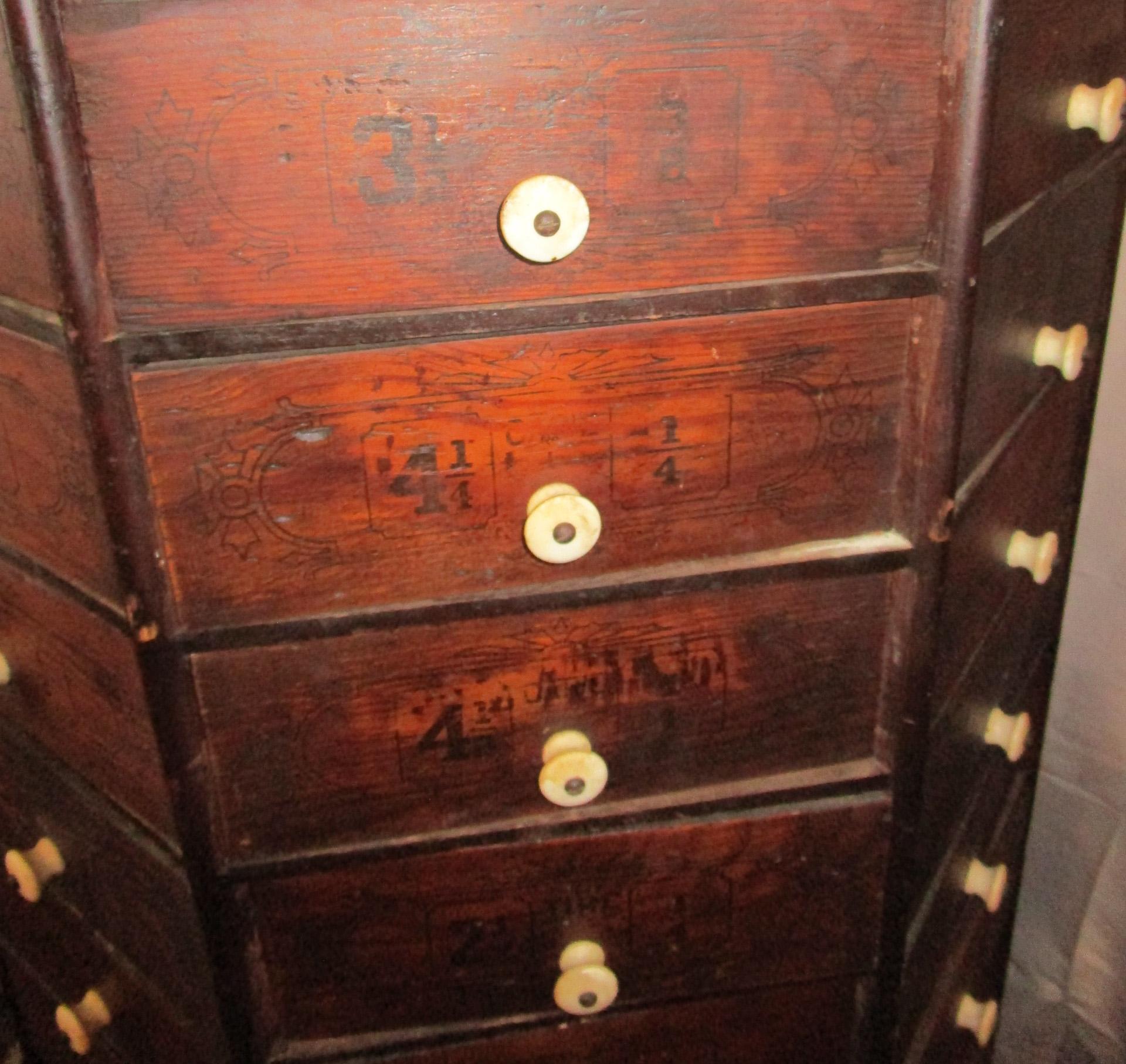 Porcelain 19th c. Hardware Store Oak Ninety-Eight Drawer Octagonal Screw and Bolt Cabinet