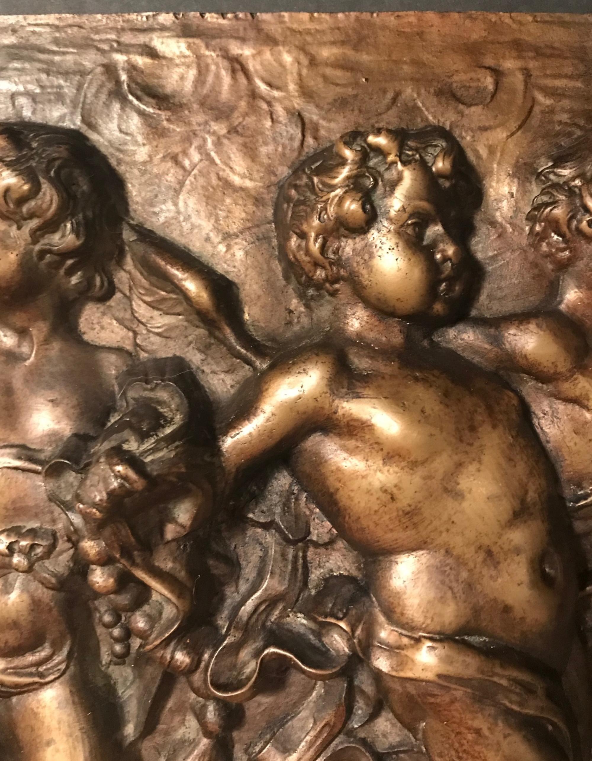 19th century heavy French bronze relief plaque of 3 dancing putti with tambourines.

This heavy and beautiful 19th century French bronze plaque features three charming dancing putti with tambourines. The movement of the limbs and clothes gives the