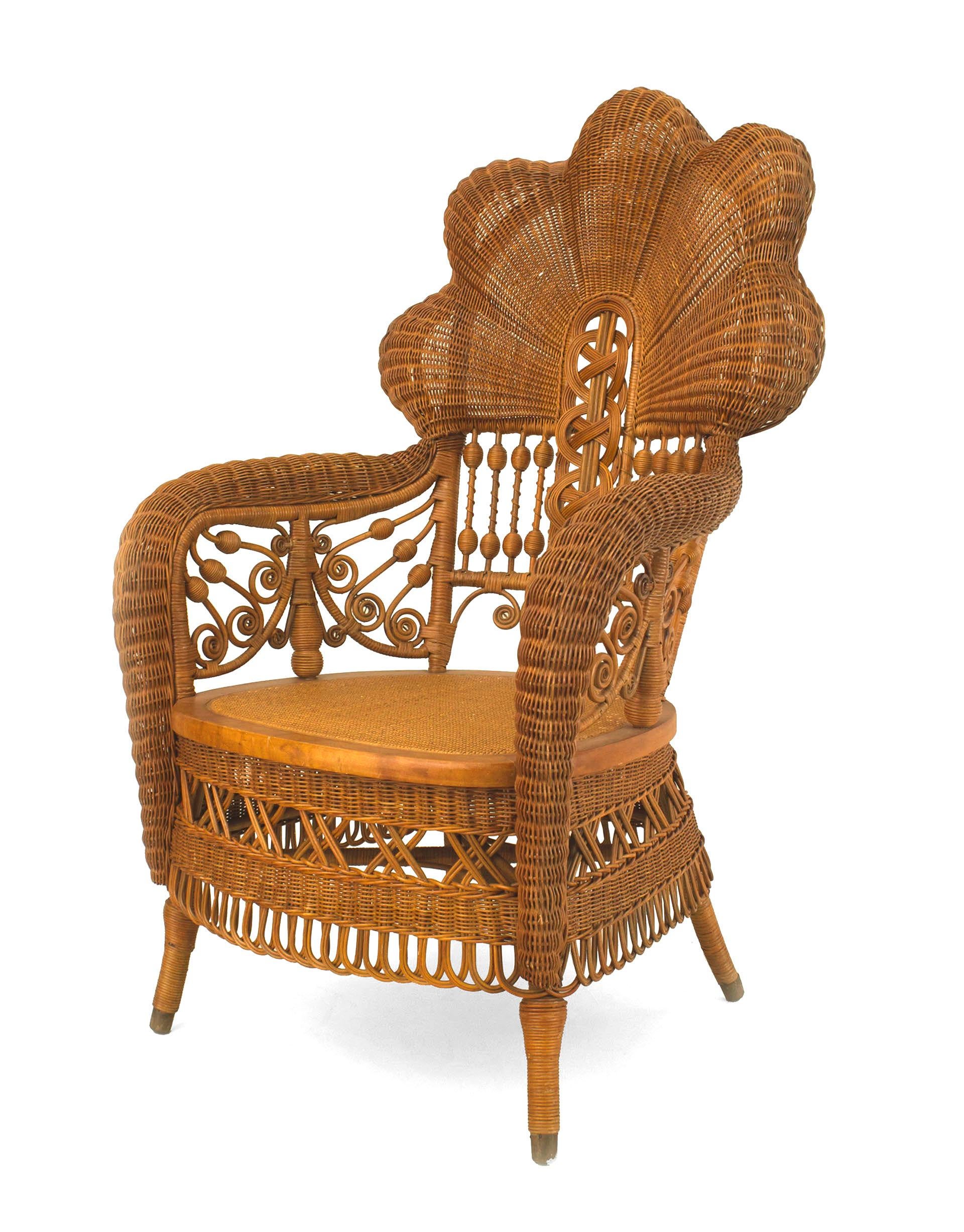 American Victorian natural wicker arm chair with fan shaped back with scroll and filigree design. (Heywood Brothers)
