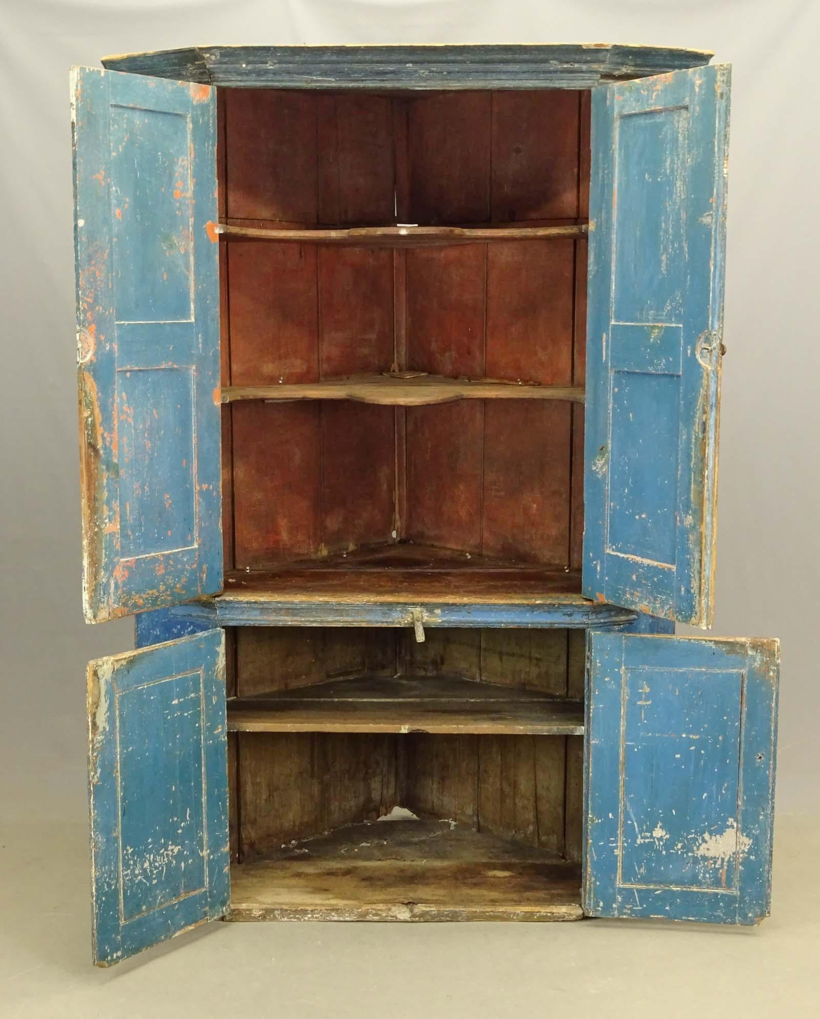 Rare large 19th century Hudson Valley corner cupboard in old blue paint. It can easily be mistaken for 
a Swedish Baroque, 18th century cabinet / cupboard or will work well in Gustavian, French, country decor or large contemporary great room. This