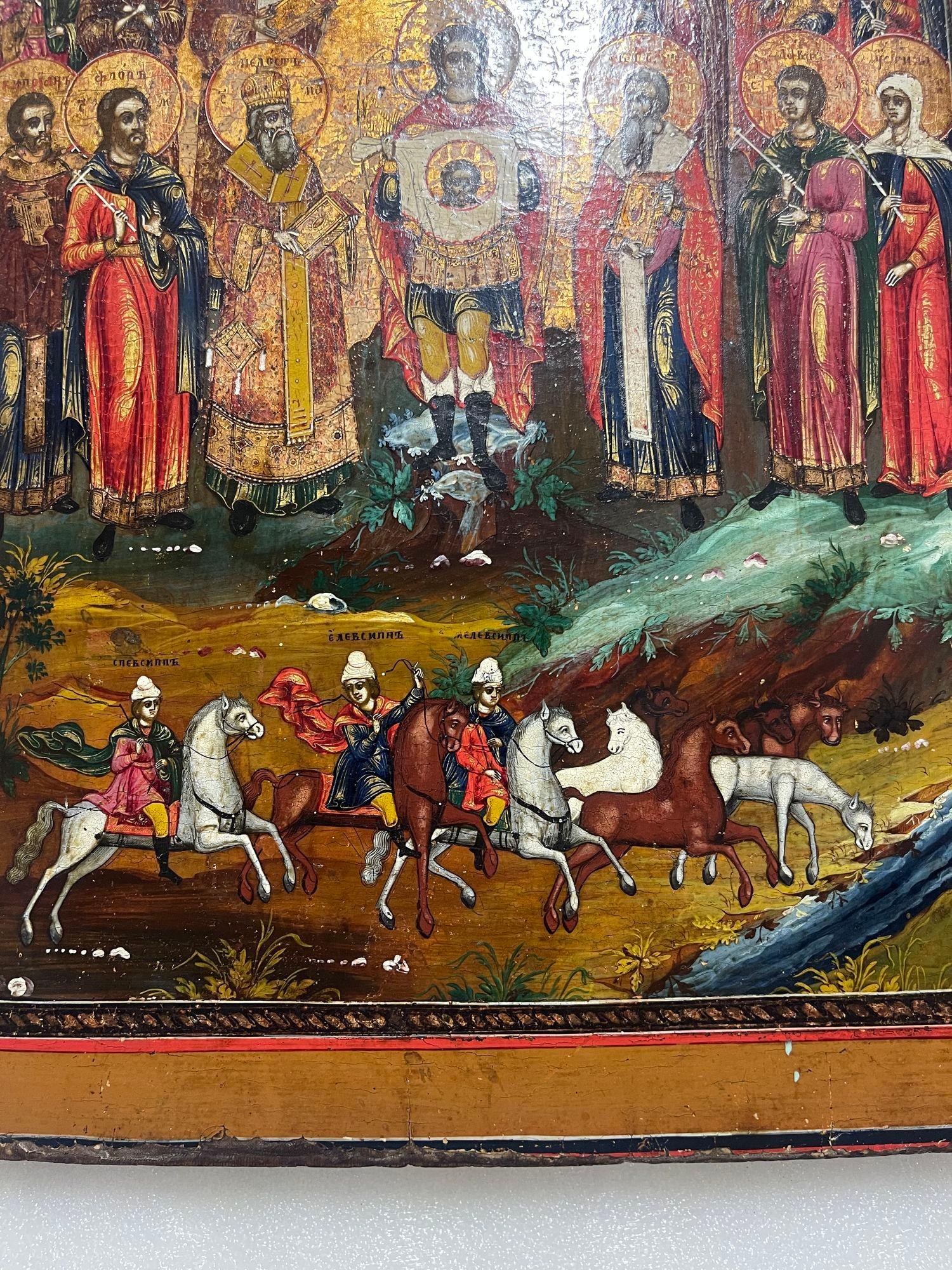 Icône du 19ème siècle, St. Floros et Lauros avec l'Archangel Michael tenant le visage du Saint-Esprit Bon état - En vente à Los Angeles, CA