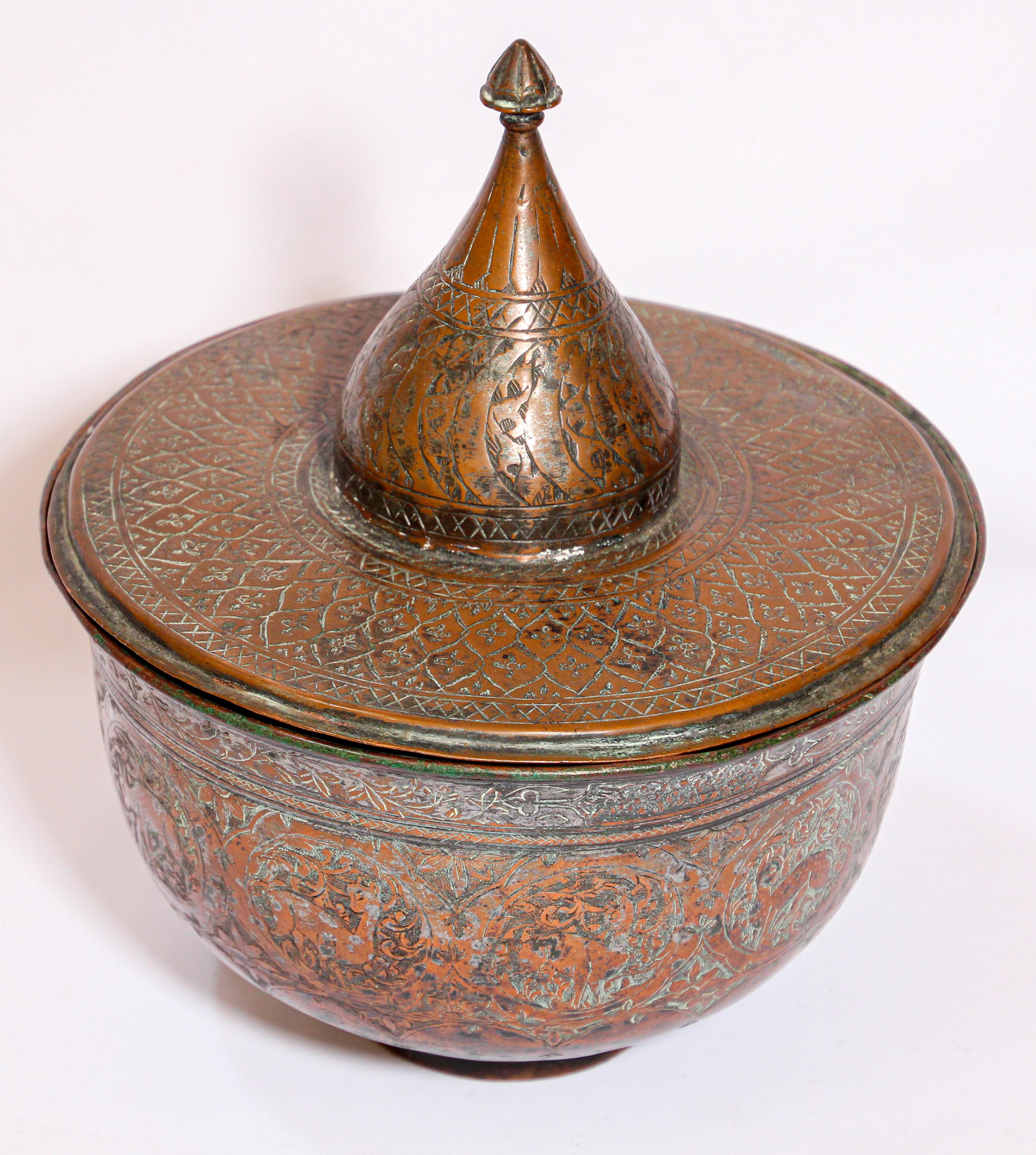Early 19th century tinned copper Indo Persian Qajar bronzed lidded bowl.
Qajar style vessel and cover with finely executed chased design all over in the form of flowing tendrils and flowers between cartouches engraved with Islamic calligraphy and