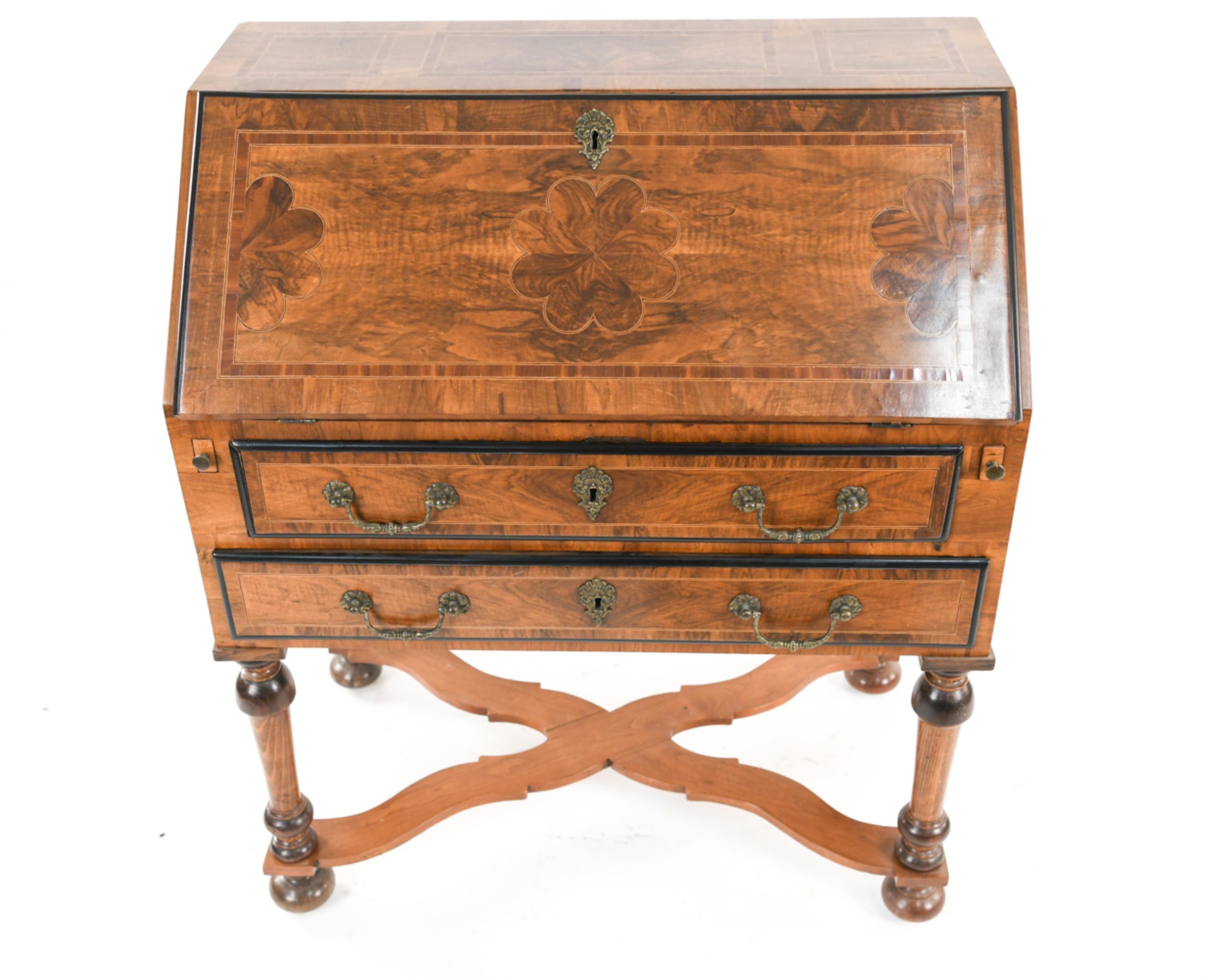 Fine example of William and Mary design with beautiful inlaid decoration. Desk with baluster leg supports joined with wavy cross stretchers, slanted drop front door supported by two pullout / pull-out supports when opened, interior with 8 drawers
