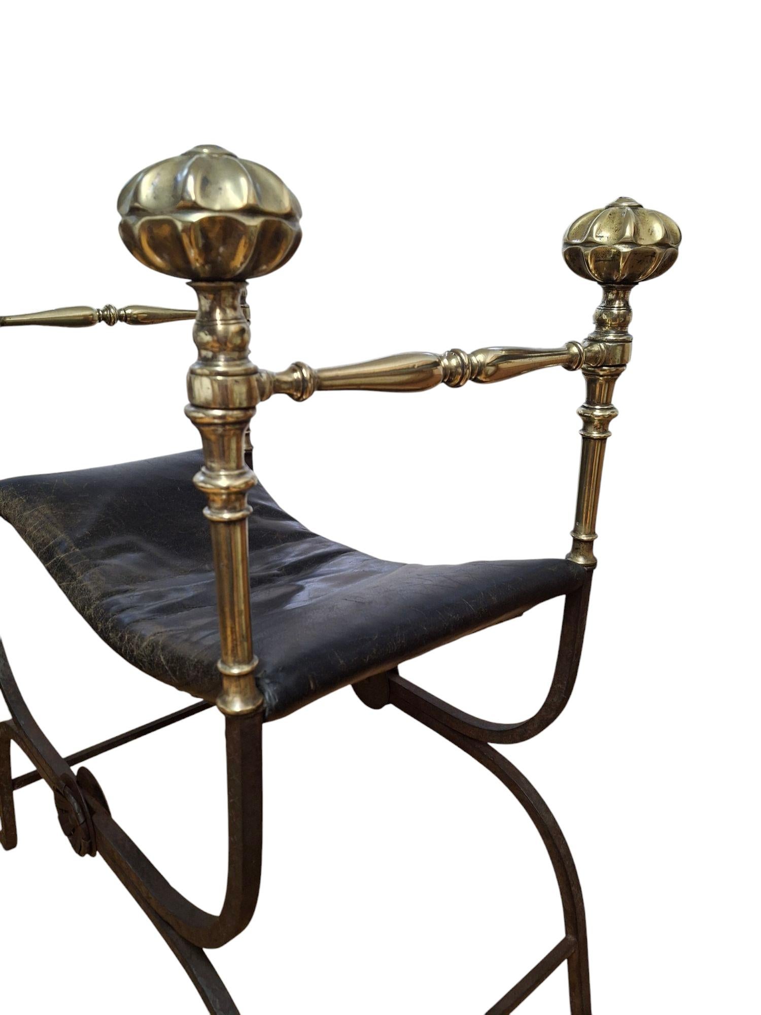 Beautiful late 19th century Italian iron and brass x-frame folding curule bench with leather seat.