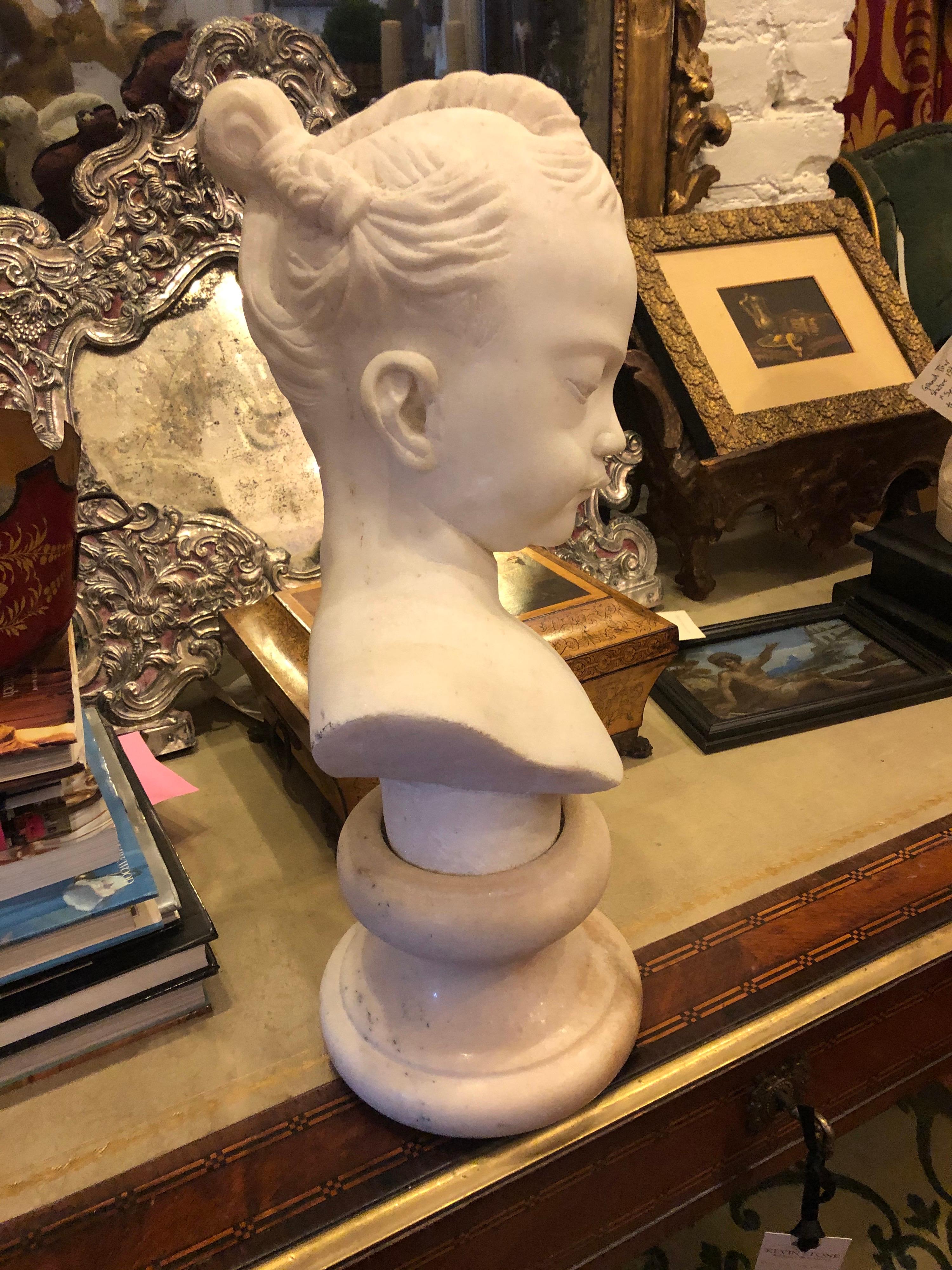 19th century marble bust of young girl on sugar marble base.