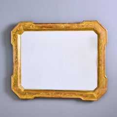 Espejo italiano del siglo XIX con marco dorado tallado