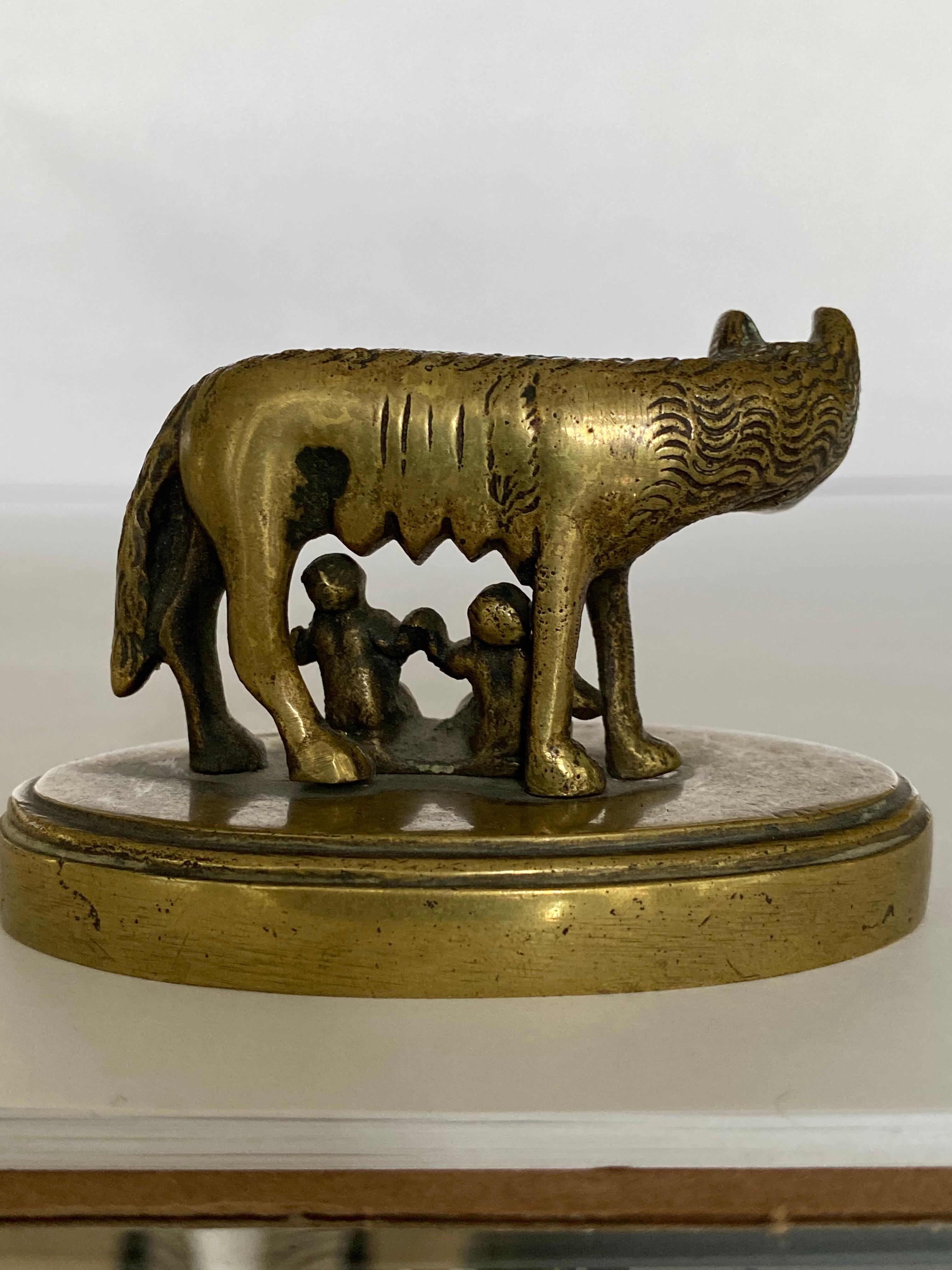 19th century Italian Grand Tour bronze of the infants Romulus and Remus suckling the She-Wolf depicting the origin myth of Rome. This sculpture is based on the original Etruscan work now in the Capitoline Museum in Rome which was unearthed in the