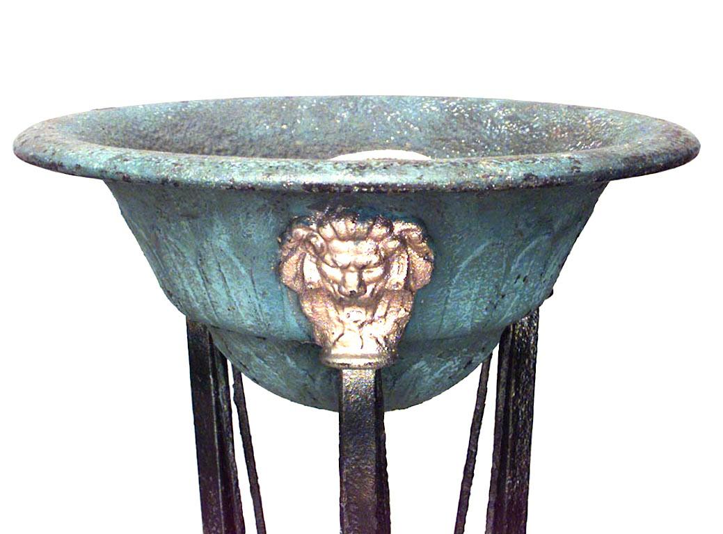 Italian Neo-classic style (19th Cent) wrought iron brazier with cross legs and 3 gold lion heads.
