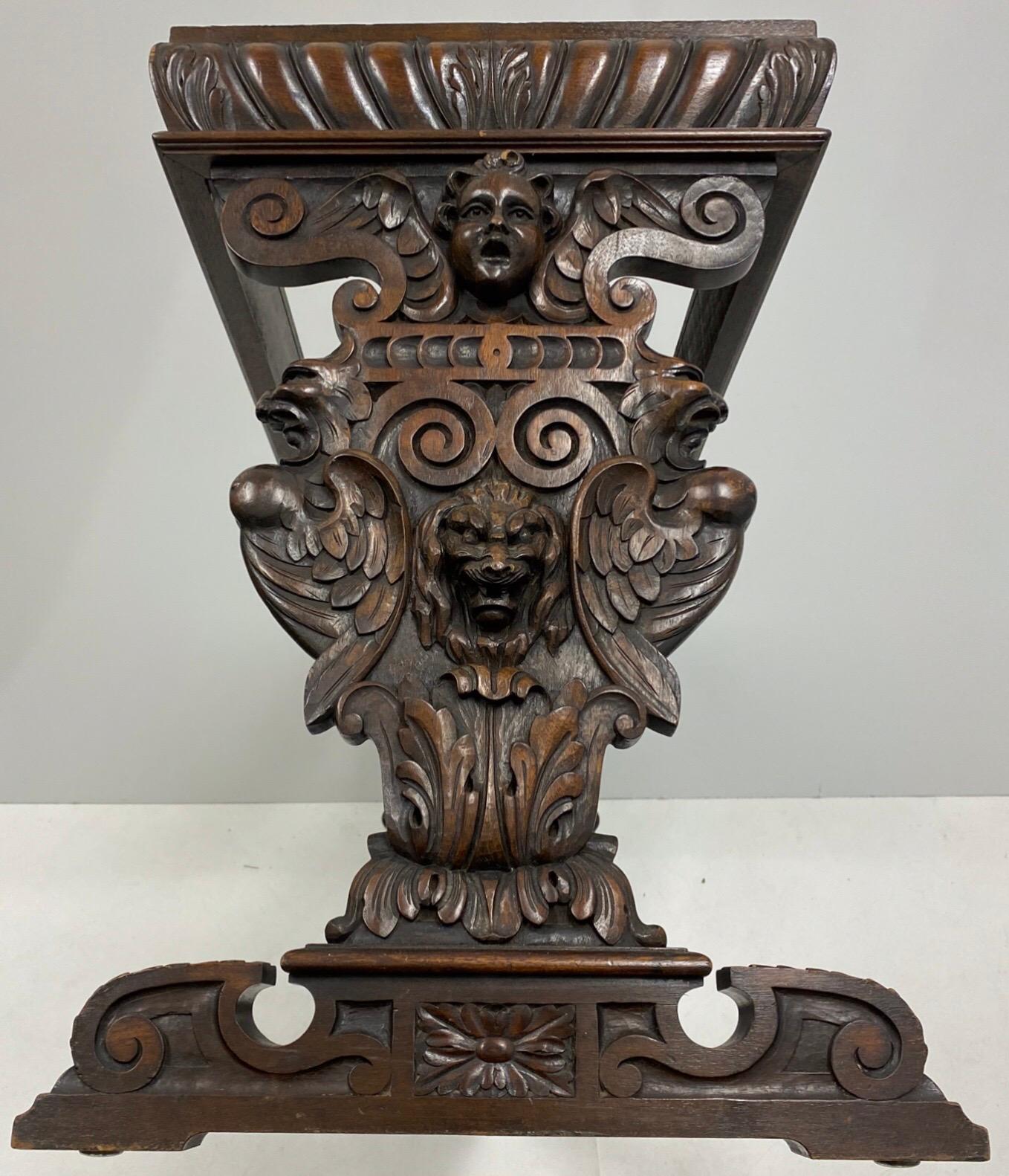 This is a wonderful Italian carved walnut console table with a beautiful siena marble top that is not attached. The carved relief depicts both dog and putti busts. It is in very good condition.