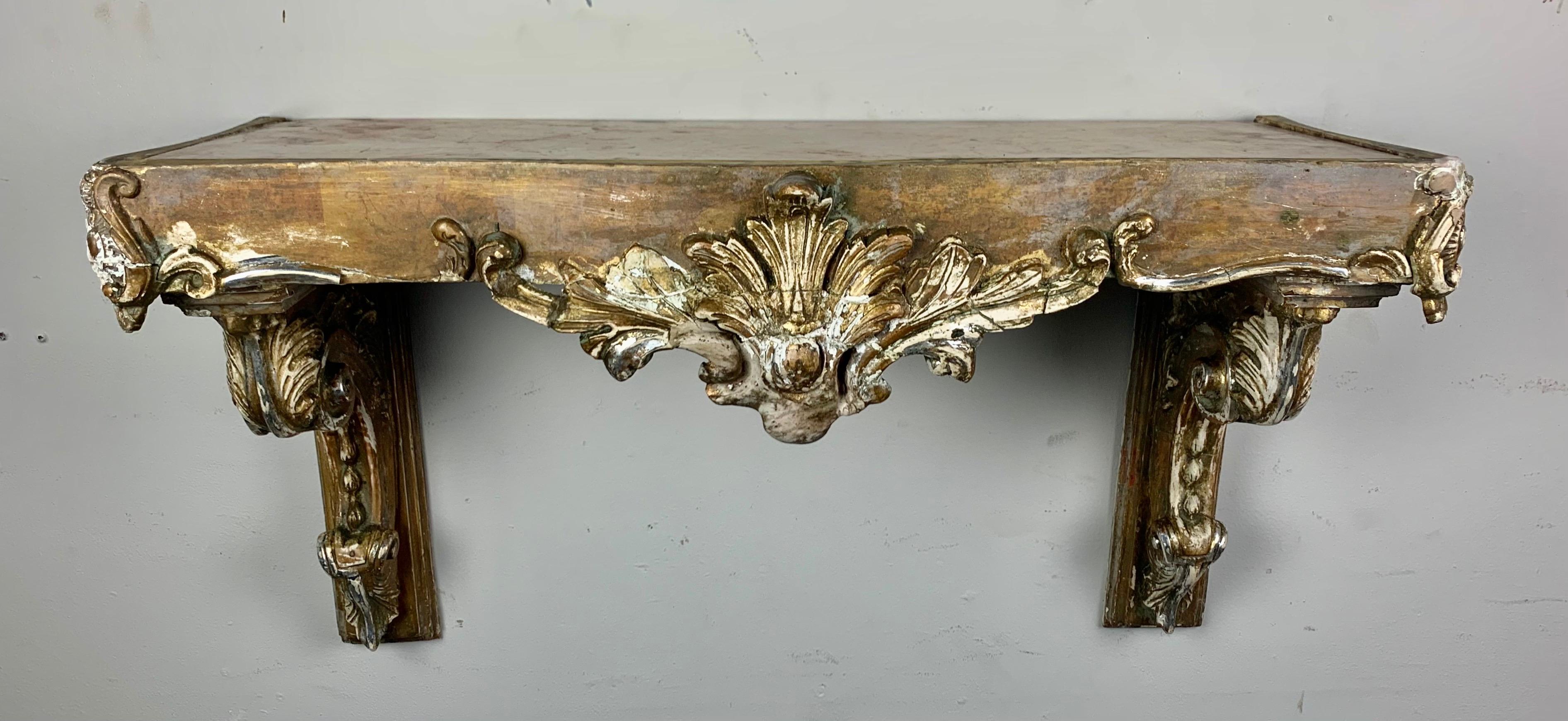 19th century Italian carved painted and parcel-gilt shelf with marble top.