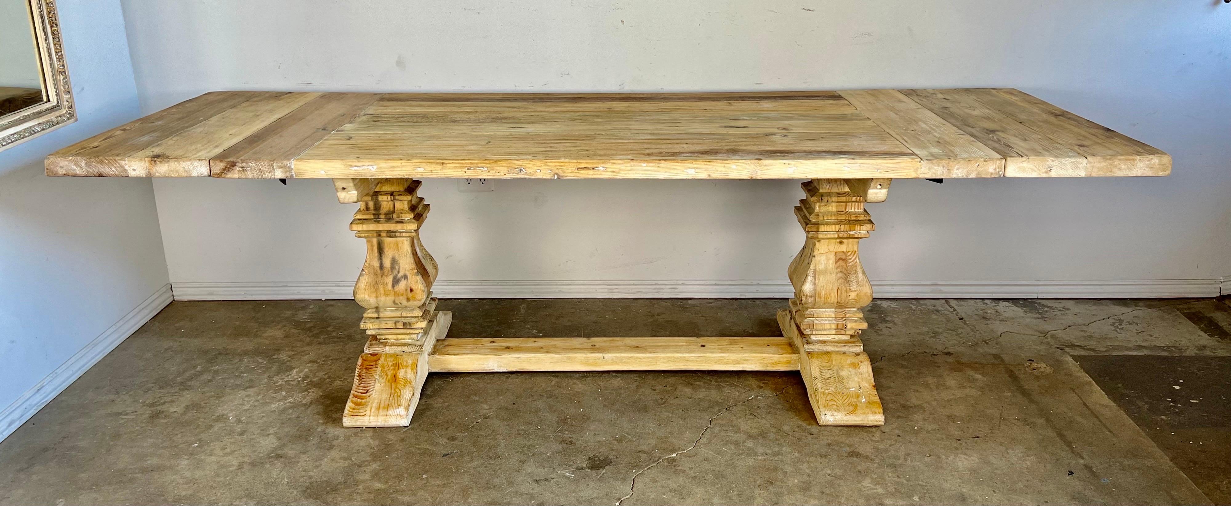 Italian Country pine table with two removable leaves. The table top stands on two pedestals and a bottom stretcher that connects the two sides. The table has a beautiful worn finish and is extremely sturdy.
Size without leaves: 72