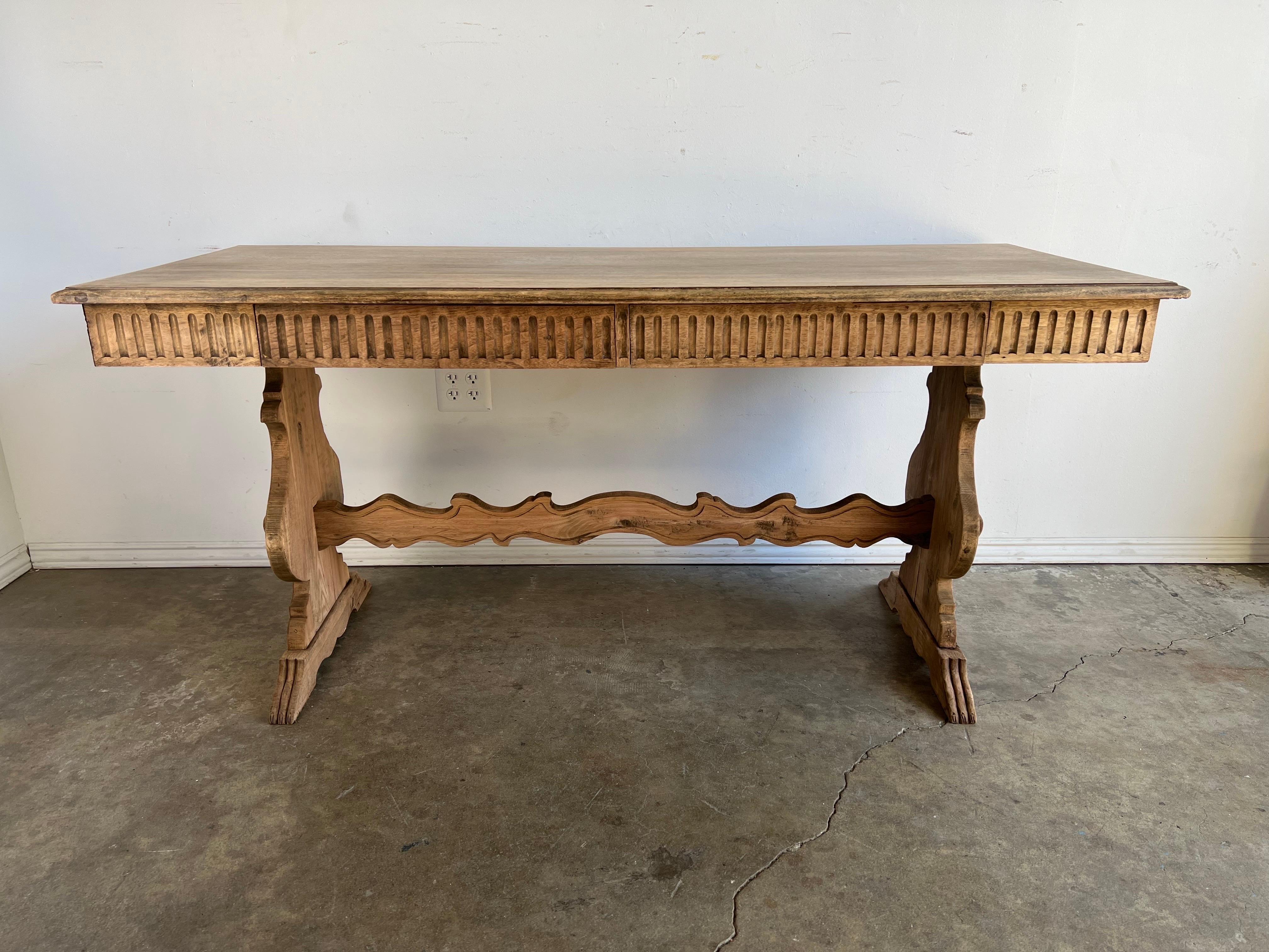 19th C. bleached Refractory Italian desk with (2) drawers. The walnut has been lightened. A scalloped bottom stretcher connects two lyre shaped pedestals. Beautiful worn, distressed finish.
