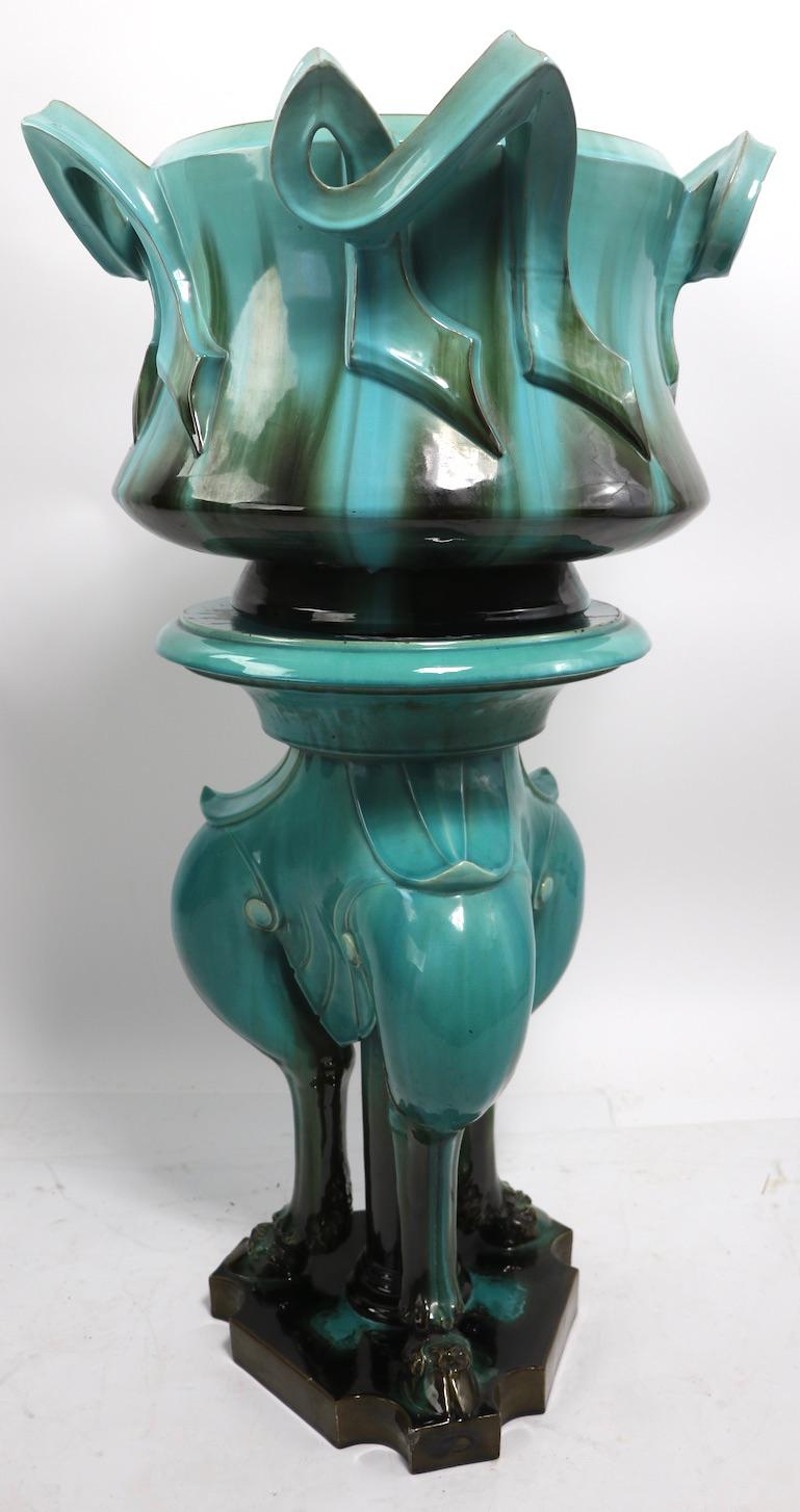 Stunning ceramic jardinière and pedestal by master French ceramist Clement Massier, circa 1880s-1890s. This example is in very good, original condition, showing only minor and inconsequential glaze loss at the bottom of the base, and one