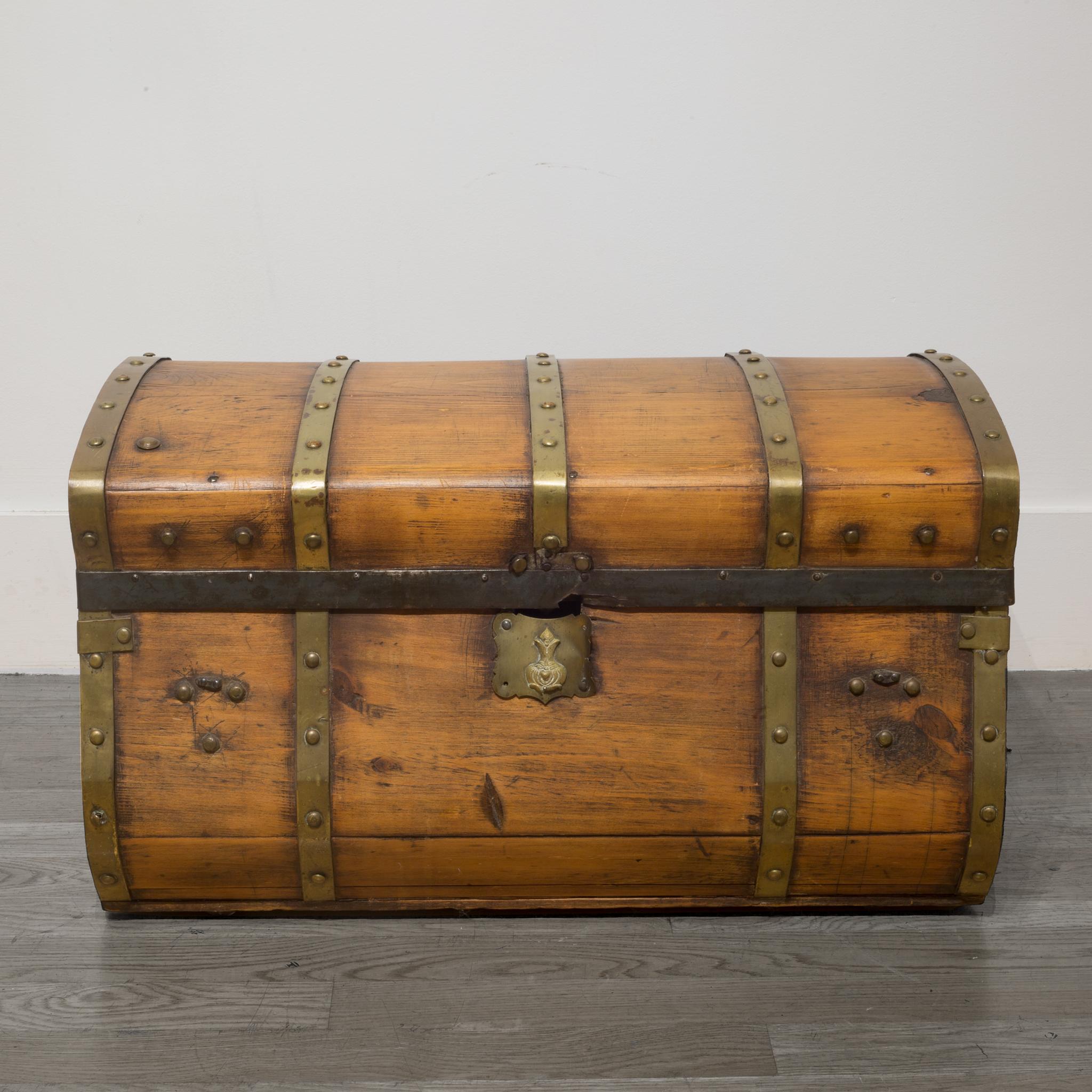 ABOUT

This is an original Jenny Lind wooden dome trunk with brass bands and lock. These trunks were used regularly on stagecoaches. The interior was lined later. This piece has retained its original finish.

 CREATOR Unknown.
 DATE OF