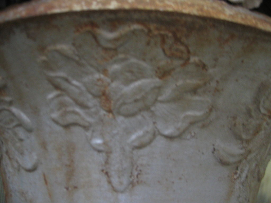 Beautifully detailed garden urn with swallow and large floral motif. Base measures: 10