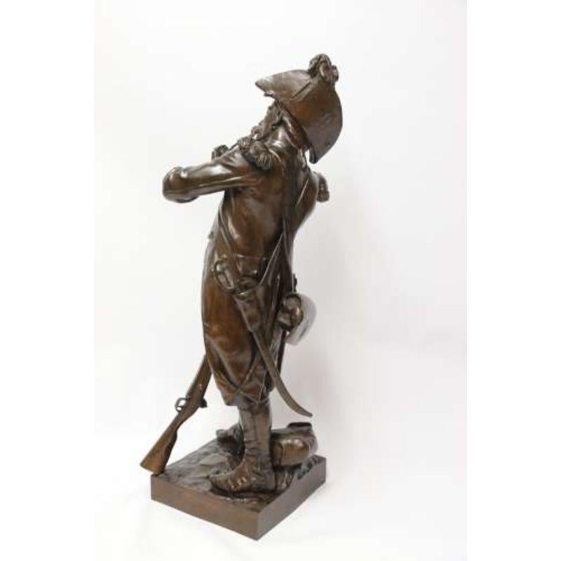 A Fine Large French Bronze Study of a Napoleonic Period Soldier by E.H. Dumaige.

This most impressive large bronze sculpture depicts an early Napoleonic period French Grenadier soldier dressed in full period uniform standing whilst lighting his