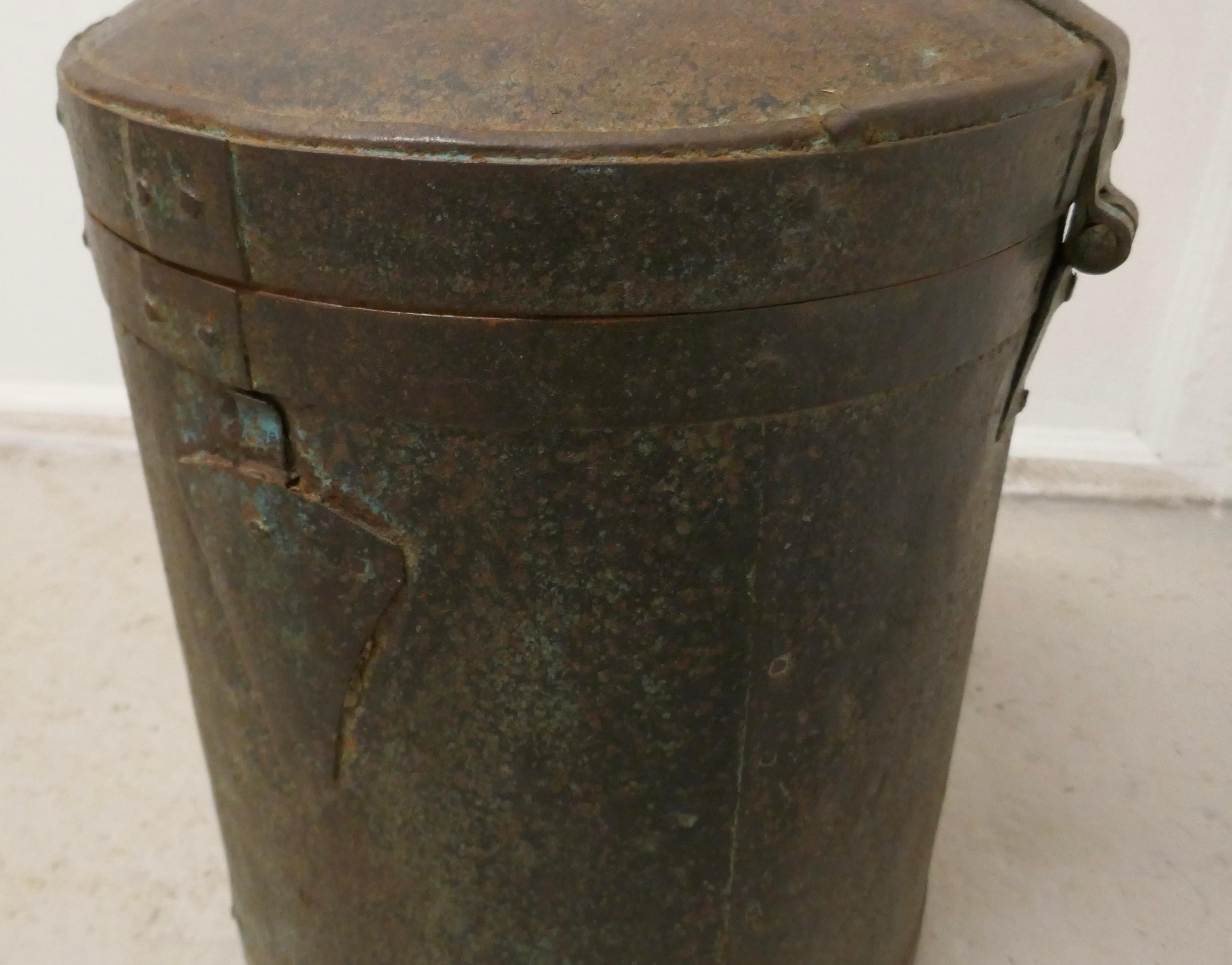 19th century large heavy metal lockable grain storage bin

This grain or rice storage bin comes from North Africa, it is made in metal, and has an aged patina, otherwise it is in sound condition
A heavy piece, it has iron reinforcing straps, a