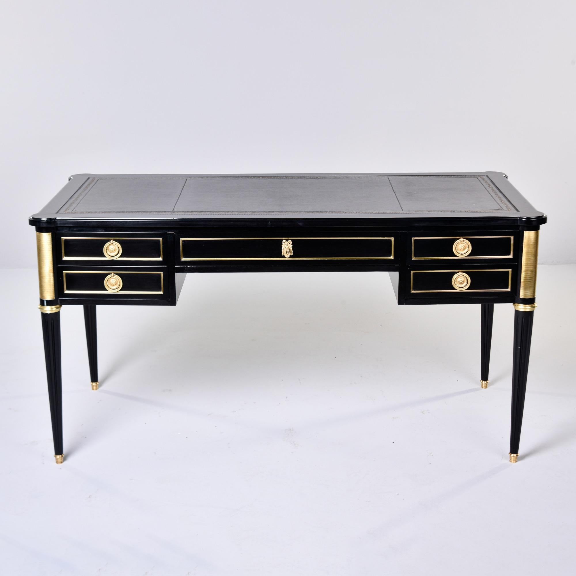 Found in France, this Louis XVI style desk dates from the 1880s. We had this mahogany desk professionally ebonised in Europe and the leather writing surfaces were also replaced. Locking top center drawer flanked on each side by two drawers. Dovetail