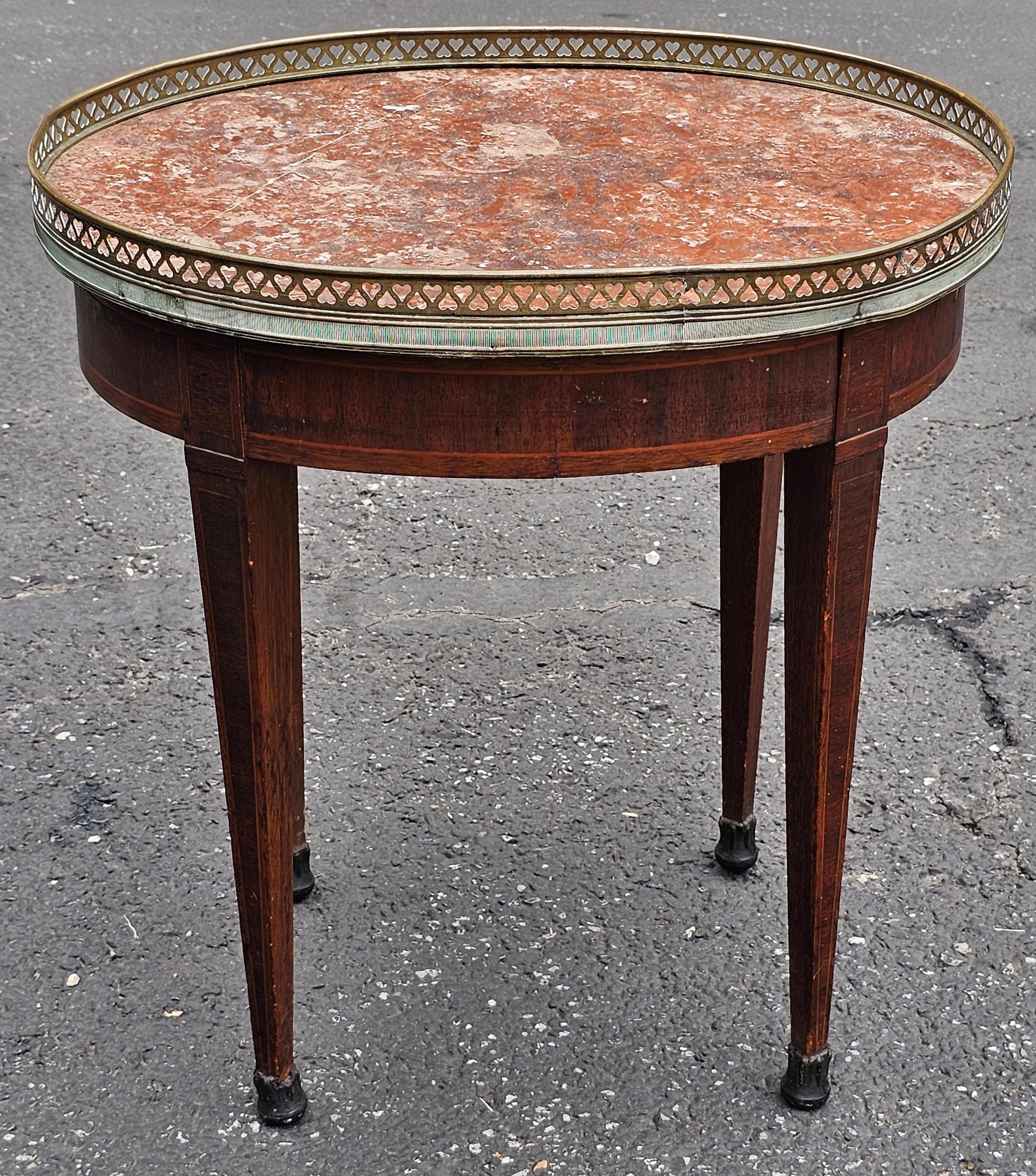 A late 19th Century Louis XVI Style Satinwiid Inla8d Mahogany and Rouge Marble with metal Galleried Oval Side Table.
Measure 20