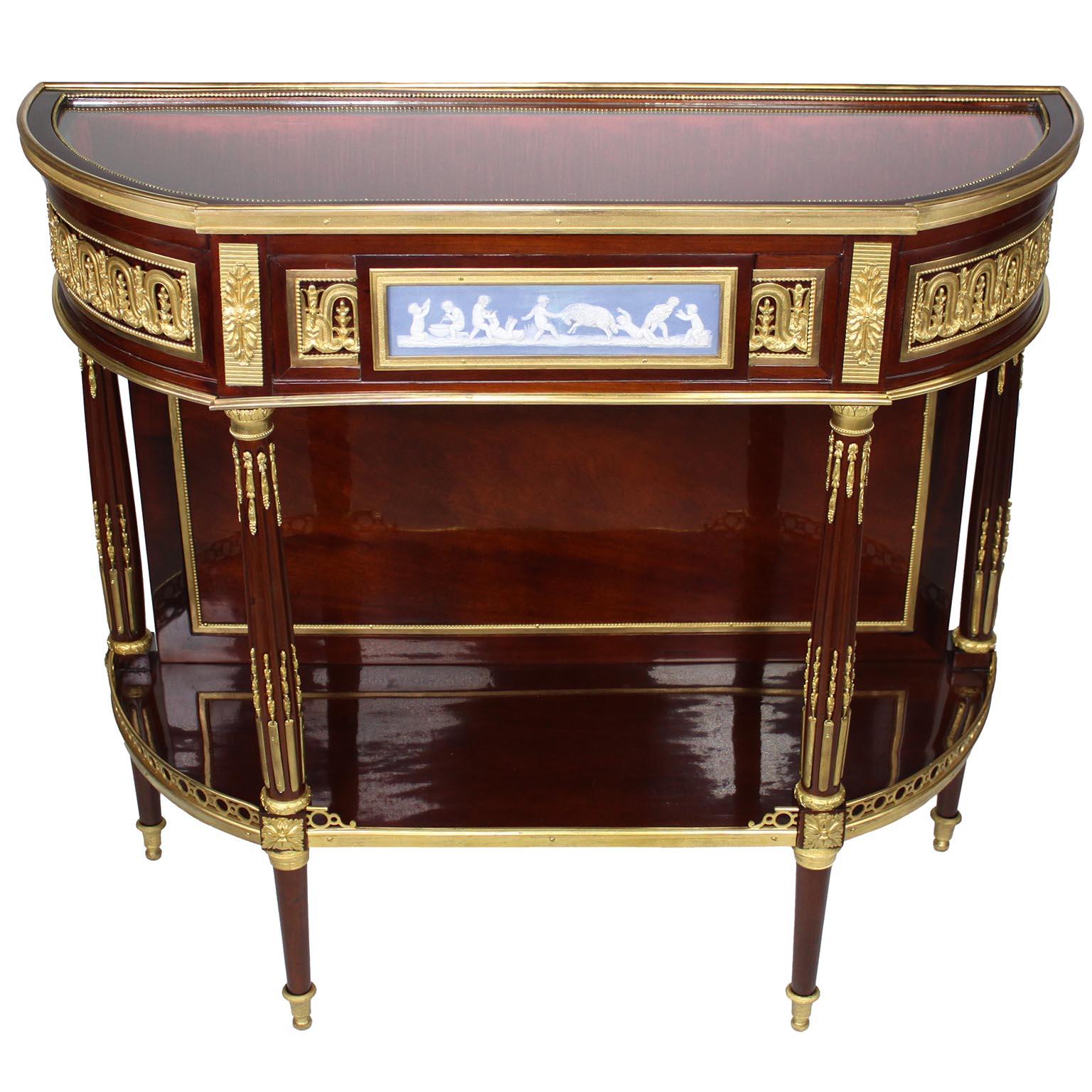 Table console à vitrine en acajou et jaspe monté sur bronze doré, inspirée des tables à dessert d'Adams I.C. (vers 1750-après 1810), de style Louis XVI français du XIXe siècle. Cette console en forme de demilune comporte un compartiment vitrine