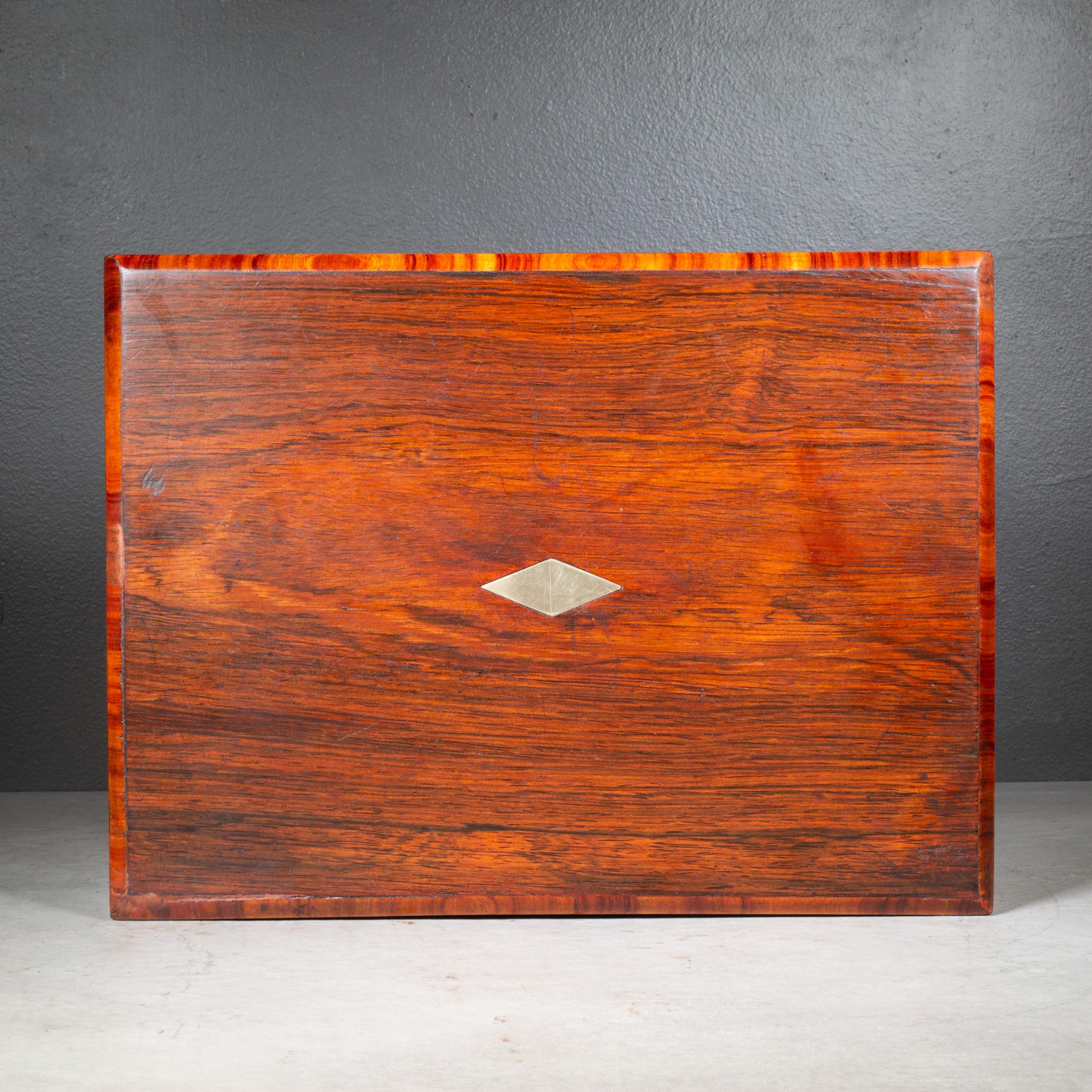 ABOUT

A 19th century portable Mahogany lap desk trimmed in Tiger Maple that opens up to create a writing surface on original velvet. Top and bottom lift open to reveal storage areas along with an area for writing instruments and ink wells. Brass