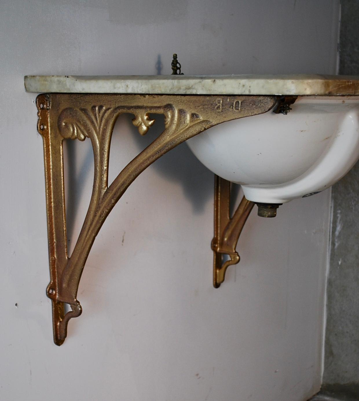 Salvaged marble counter with original sink with brass finished brackets. 
The plumbing mechanism is easily adaptable for new pipes .The sink is equipped with overflow drain and has no cracks.
Salvaged from an old Hotel in Vancouver years