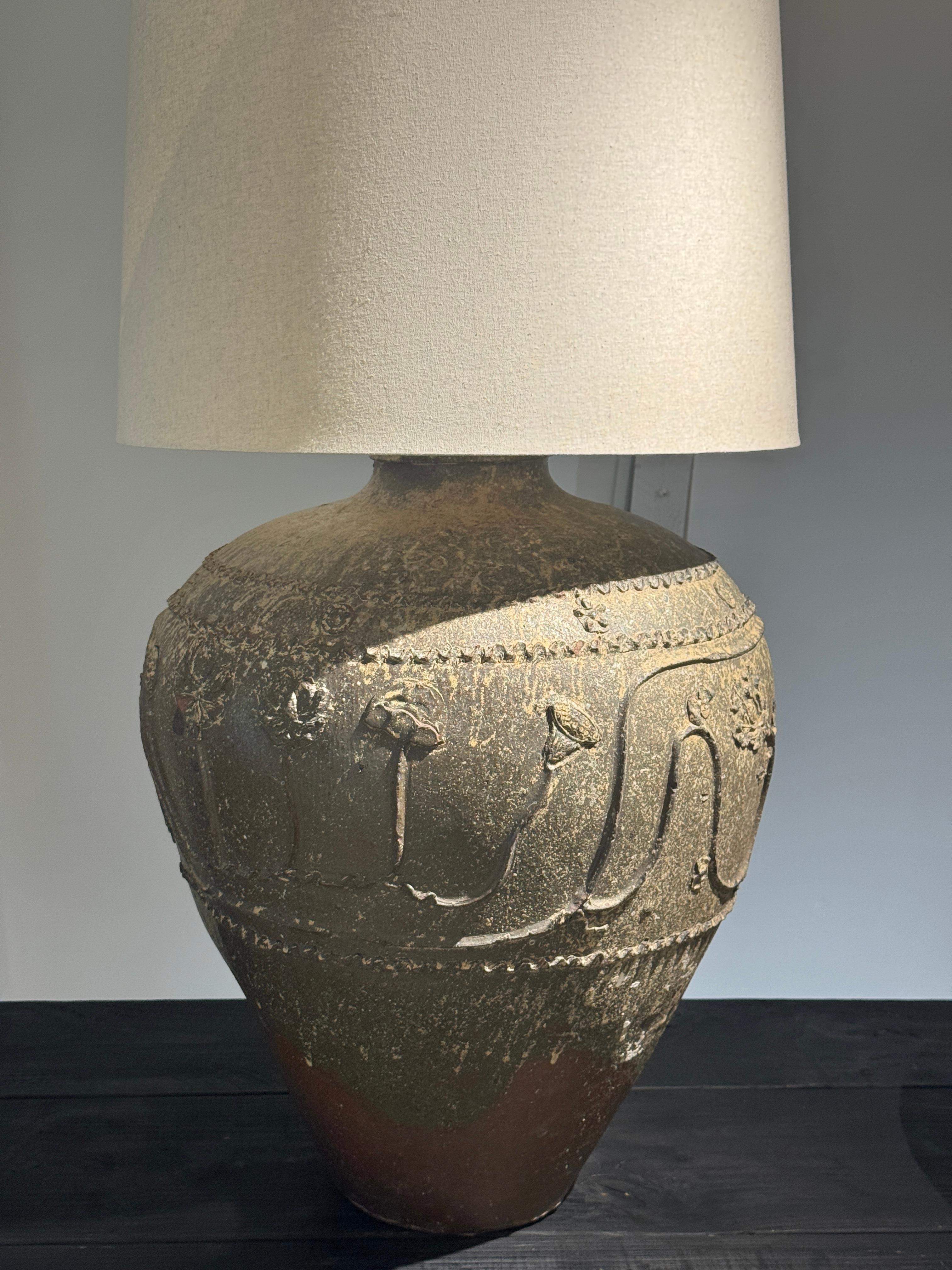 19th Century Chinese Ceramic Lotus grain vessel converted to lamp.  This dramatic lamp is oversized in scale (40