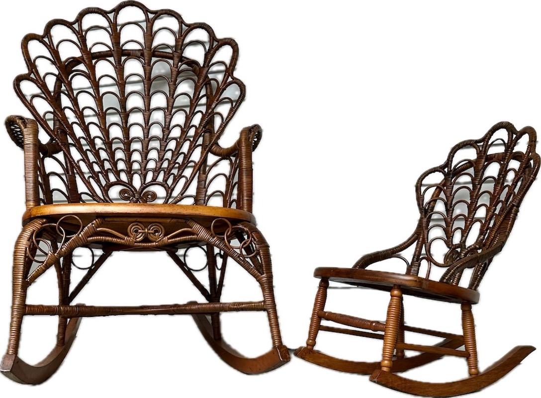 A large late 19th C. Shell back designed Adult wicker rocker and matching Childs rocker by the famous Wakefield Rattan Company of Wakefield Massachusetts.
They are both beautifully done in a gorgeous natural finish with natural pressed cane seats