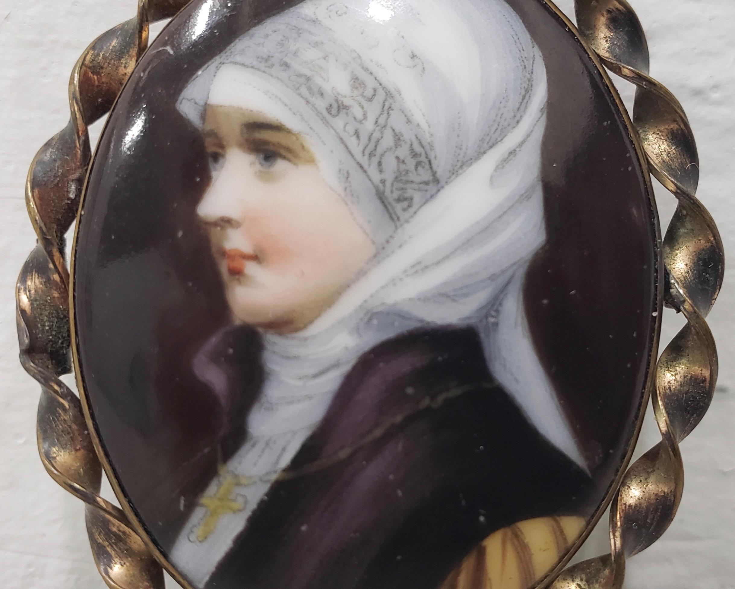 19th century miniature portrait of a nun on porcelain with brooch frame

Wonderful antique portrait of a nun hand painted on porcelain.

The portrait is housed in a brass frame that can be worn as a brooch.

Porcelain dimensions 1.25