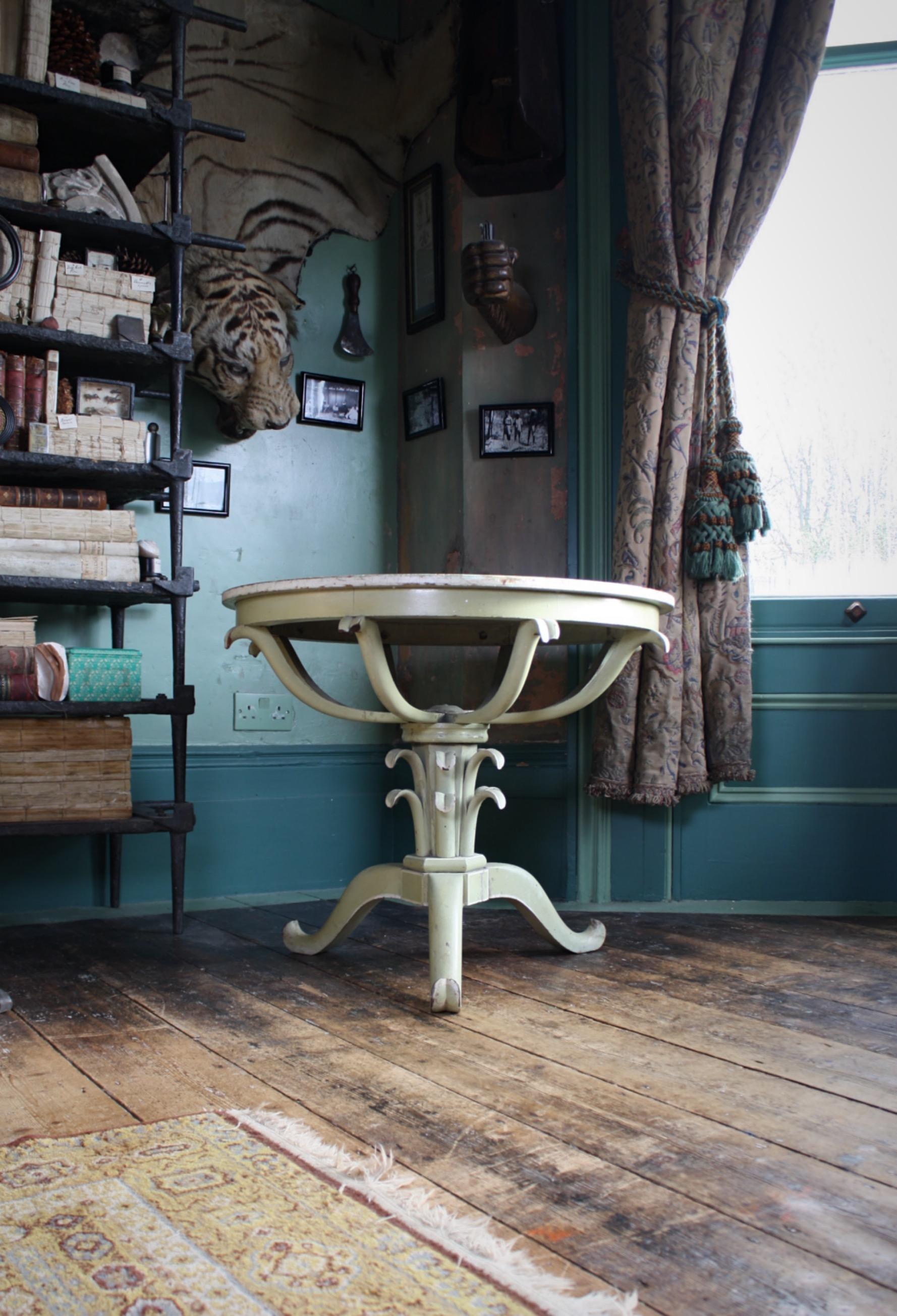 A 19th century Italian painted occasional table, 

Purchased from Portmeirion (The Welsh Italian City) Gwynedd, North Wales and believed to have been the table on which Noel Coward wrote 'Blithe Spirit', the circular top painted in a mist green