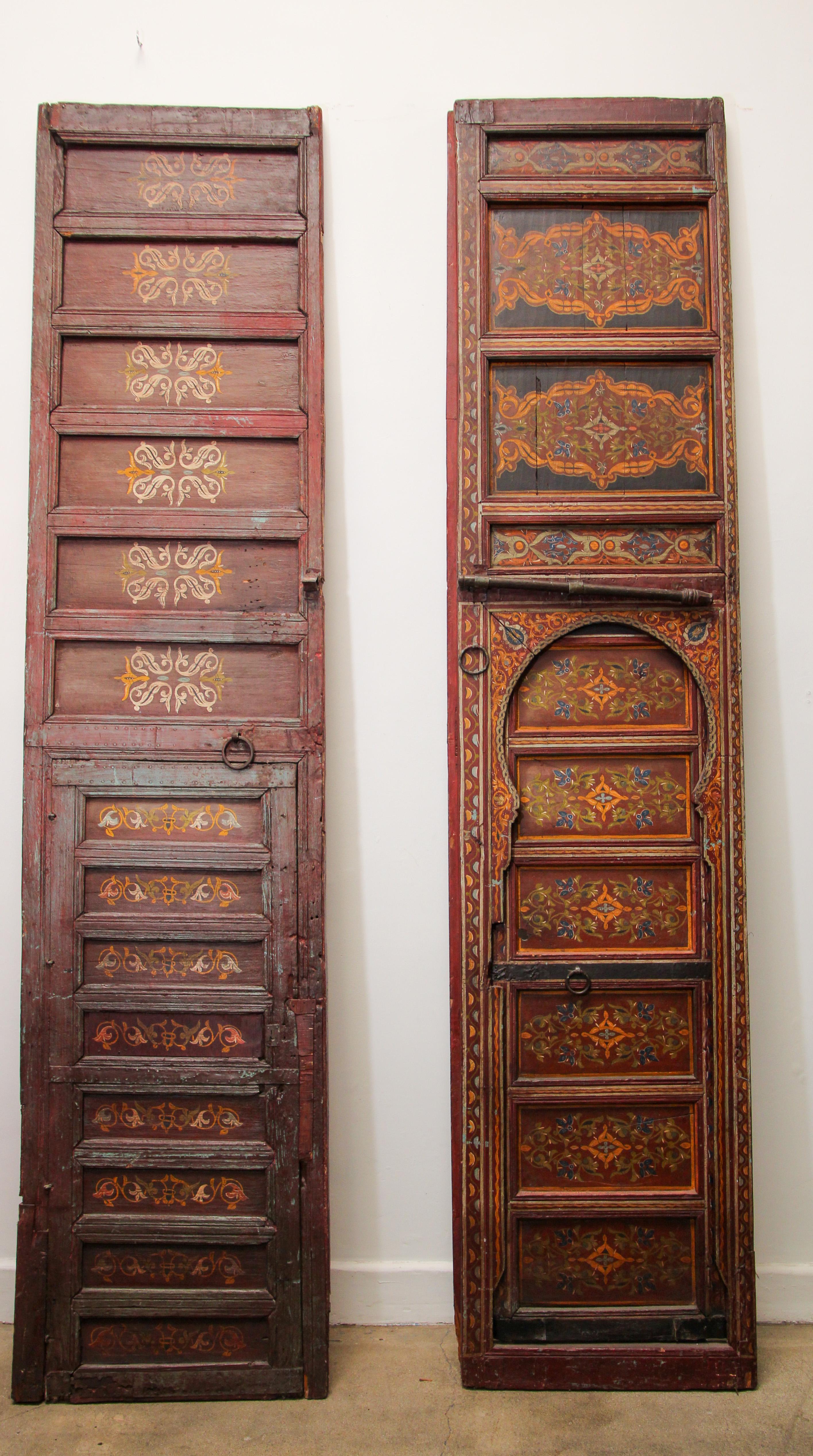 Moroccan huge antique doors from a Ryad in Fez, amazing hand painted artwork.
Multicolored geometrical Moorish designs in deep red, green, yellow.
Moroccan doors and furniture is most noted for the use of beautiful Moorish hand-painted and hand