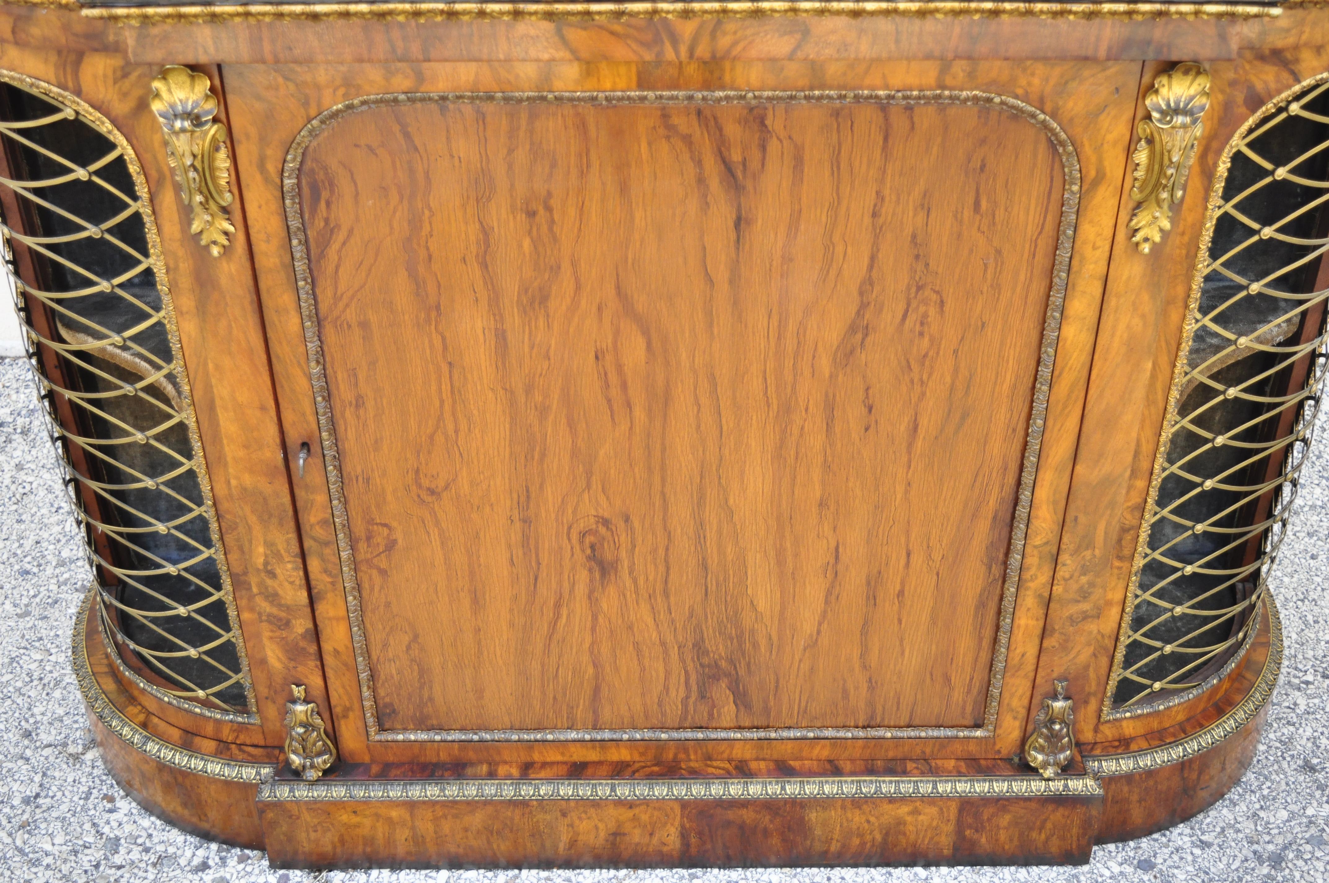 19th century Napoleon III style rosewood sideboard buffet credenza cabinet with brass lattice. Item features shaped wooden top with faux marbleized finish, blue velvet interior, bronze/brass ormolu, beautiful rosewood veneer, 1 swing door, working