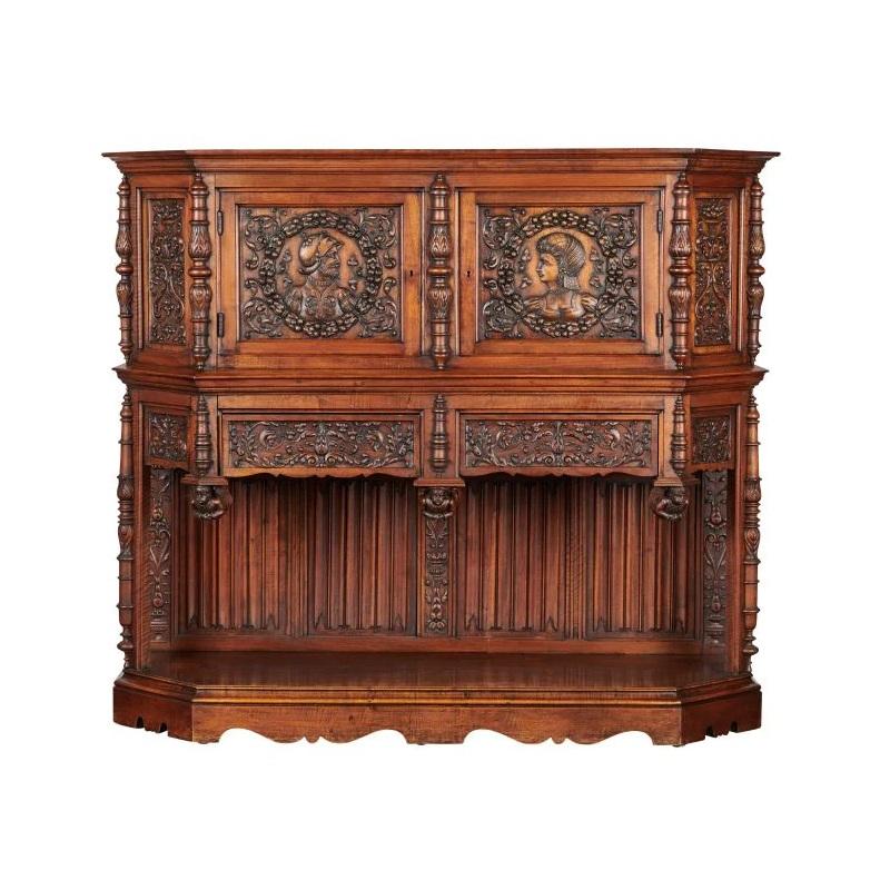 We have a strong love for Renaissance Revival furniture and art here at Galeries Talitha Marco and this piece embodies that entirely! This cabinet is made out of French oak and is dated early 19th C., featuring a male and female medallion on the