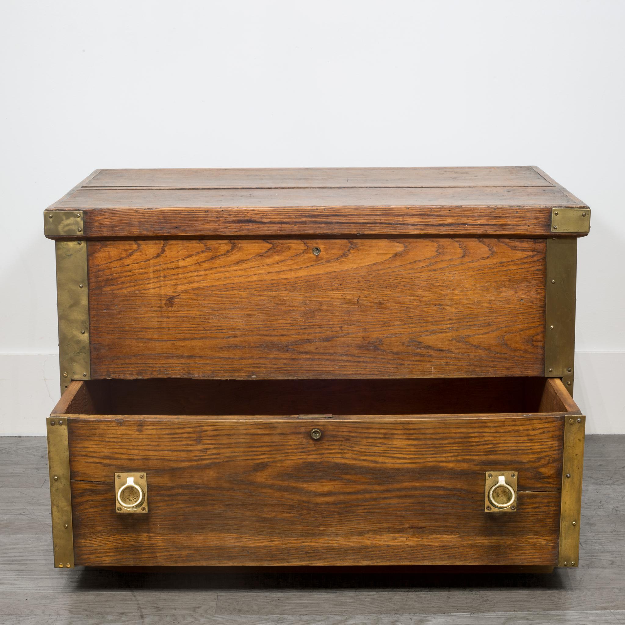 About

This is an English Oak Campaign trunk clad in brass with solid brass handles on the sides and brass pulls in the front. The top lifts up for ample storage with a bottom drawer to store more items. This piece is very solidly constructed and