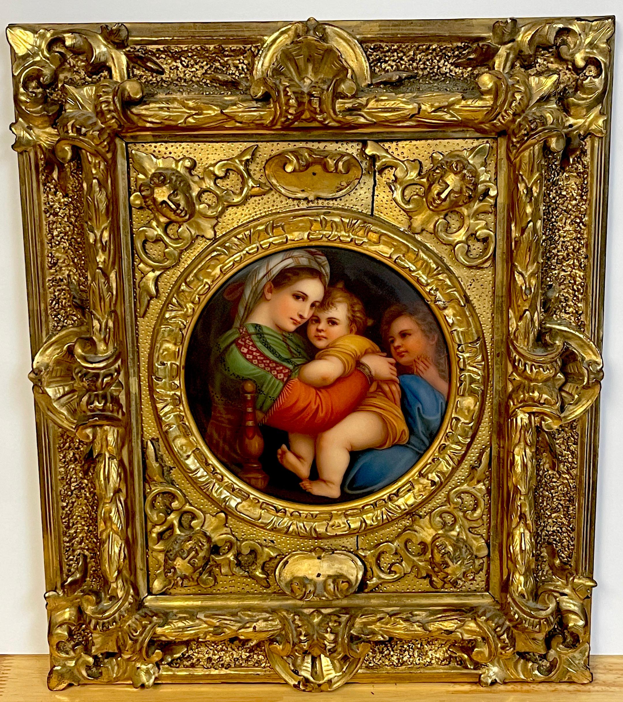 19th C painting on porcelain 'Madonna della Seggiola' after Raphael 
Presented in a fantastically carved giltwood figural frame, holding the 7-Inch diameter German painting on porcelain, 'Madonna della Seggiola' after Raphael.
The porcelain plaque