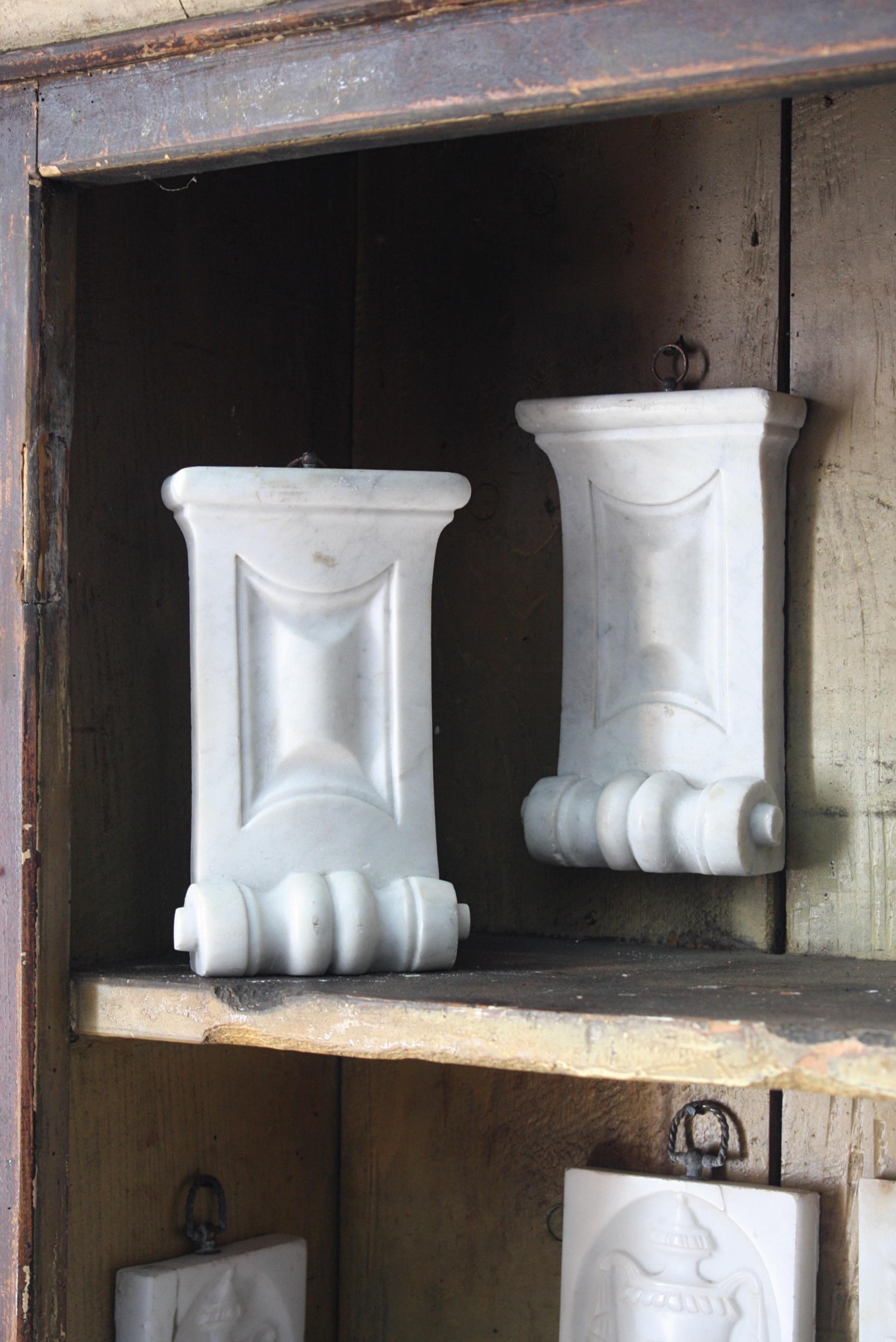A pair of marble elements with a well carved restrained design, previously part of larger architectural feature like a grand fireplace.

Each section has a good decorative patina, Dating from the early 19th century and English in origin.

Both