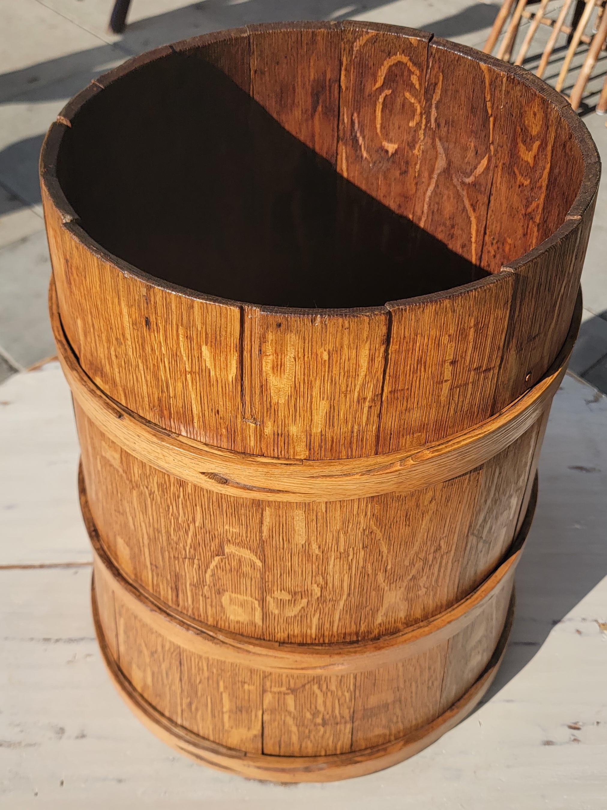 19th C Piggin or measure bucket. The bucket has tight wood banding and is in great condition. Wear due to age. It would be great as an umbrella stand.