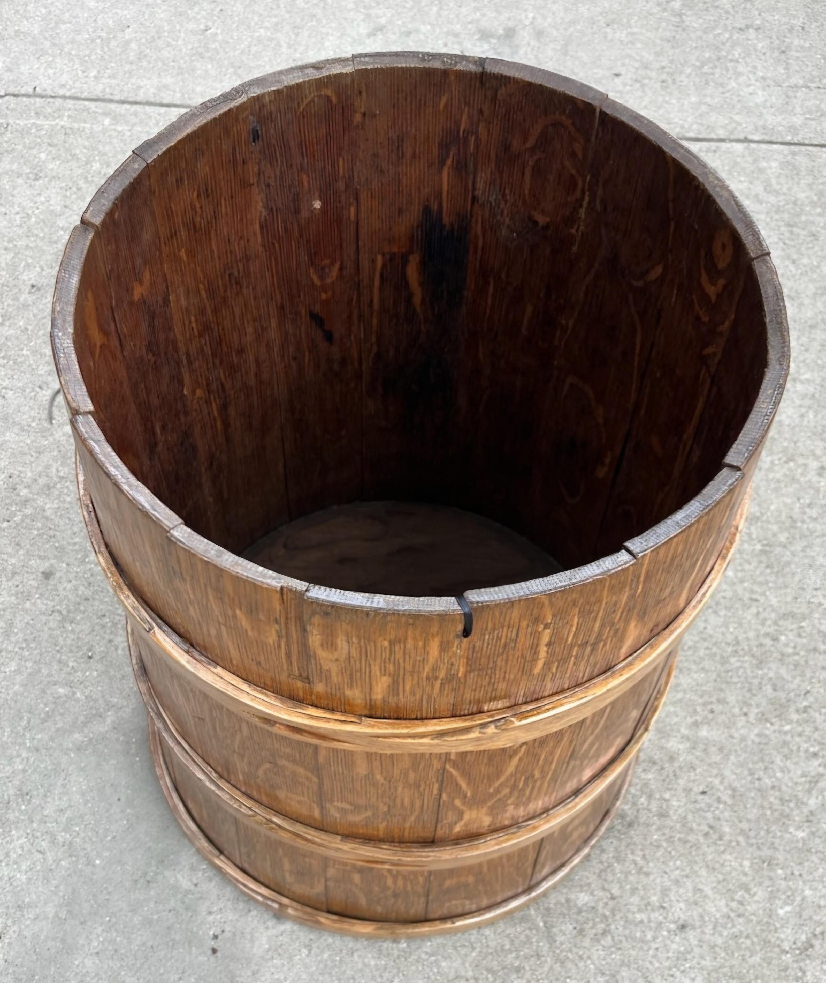 19th C Piggin or measure bucket. The bucket has tight wood banding and is in great condition. Wear due to age. It would be great as an umbrella stand.